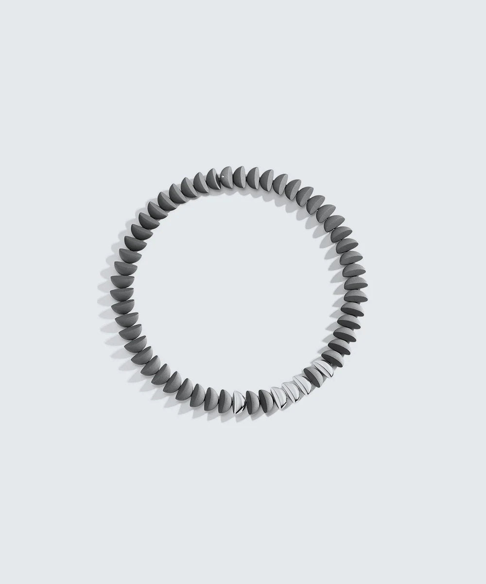 Peelerie jewelry piece in midnight luxury editorial product photo, high-contrast studio lighting