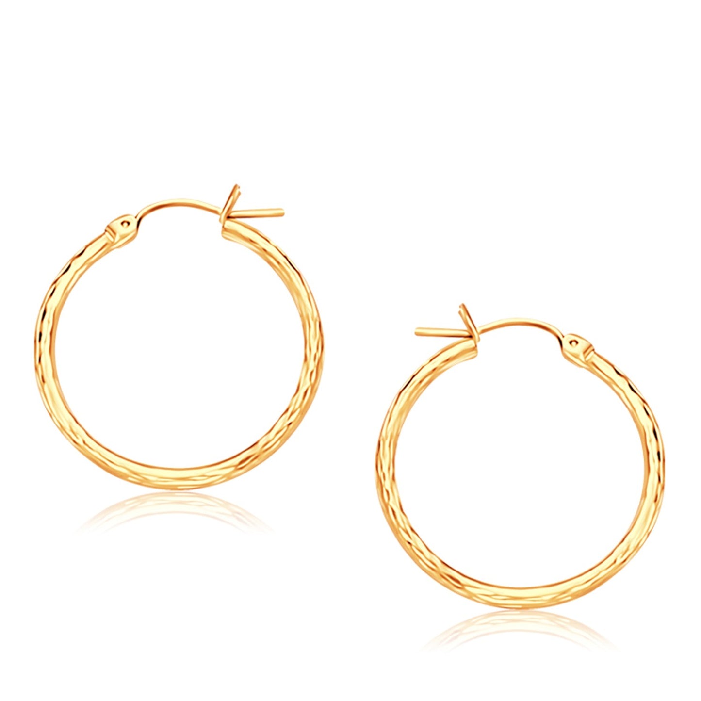 14K Yellow Gold Diamond Cut Hoop Earrings (25mm Diameter) in a sleek high-contrast midnight luxury editorial style