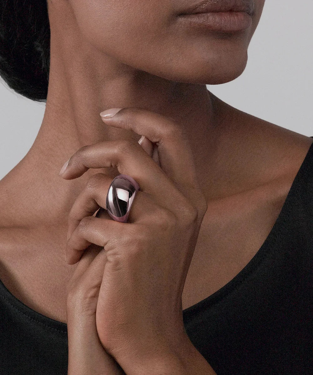 Peelerie jewelry piece in midnight luxury editorial product photo, high-contrast studio lighting