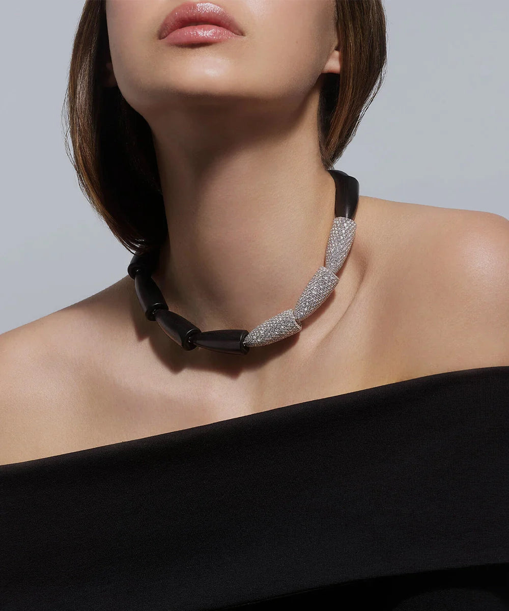 Peelerie jewelry piece in midnight luxury editorial product photo, high-contrast studio lighting