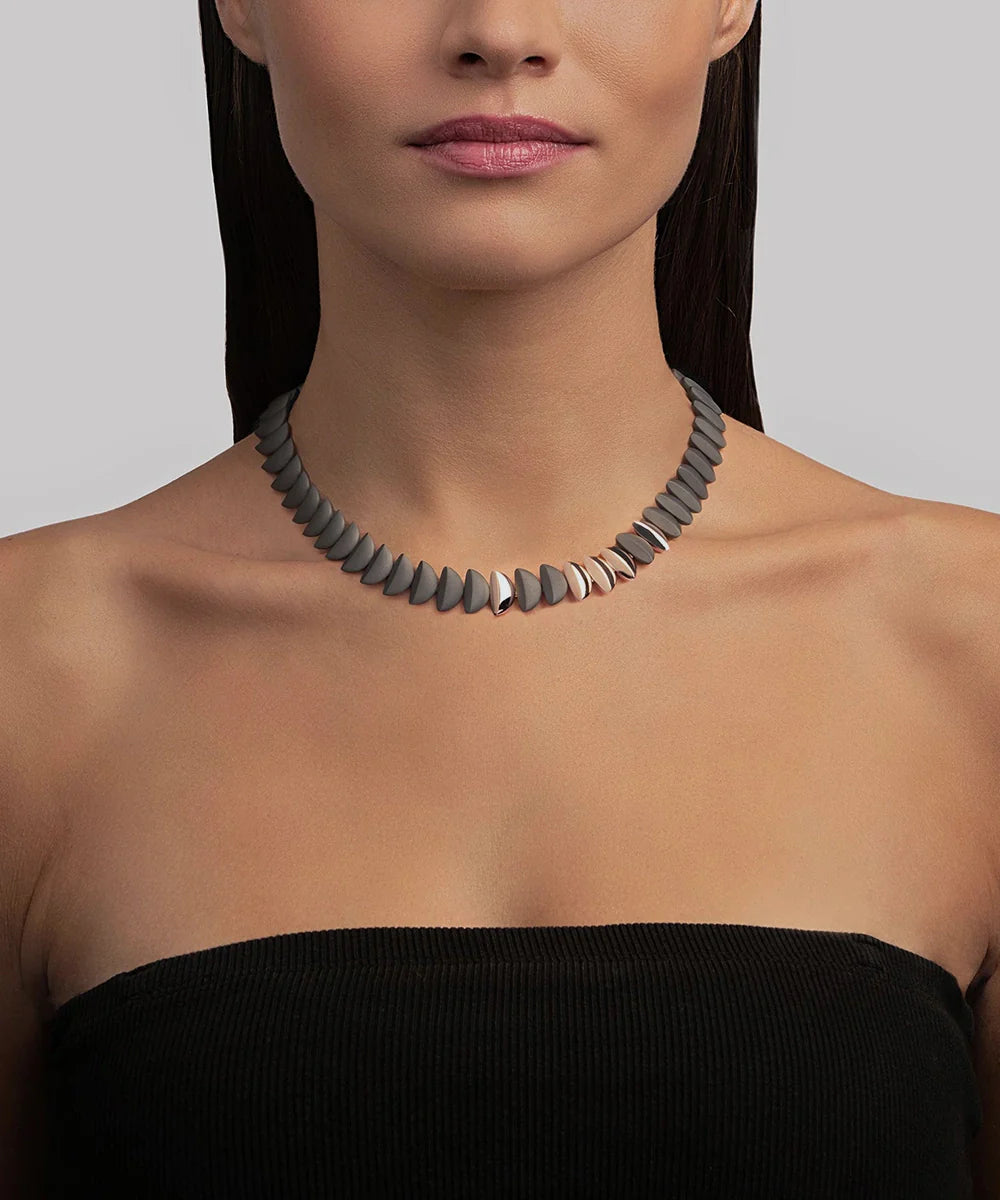 Peelerie jewelry piece in midnight luxury editorial product photo, high-contrast studio lighting