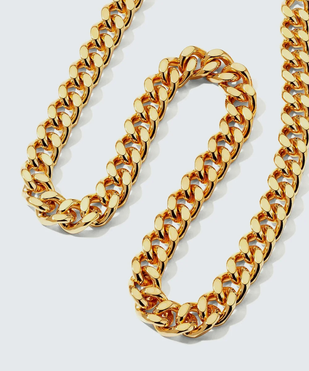 Women Gold Link Chain in a sleek high-contrast midnight luxury editorial style