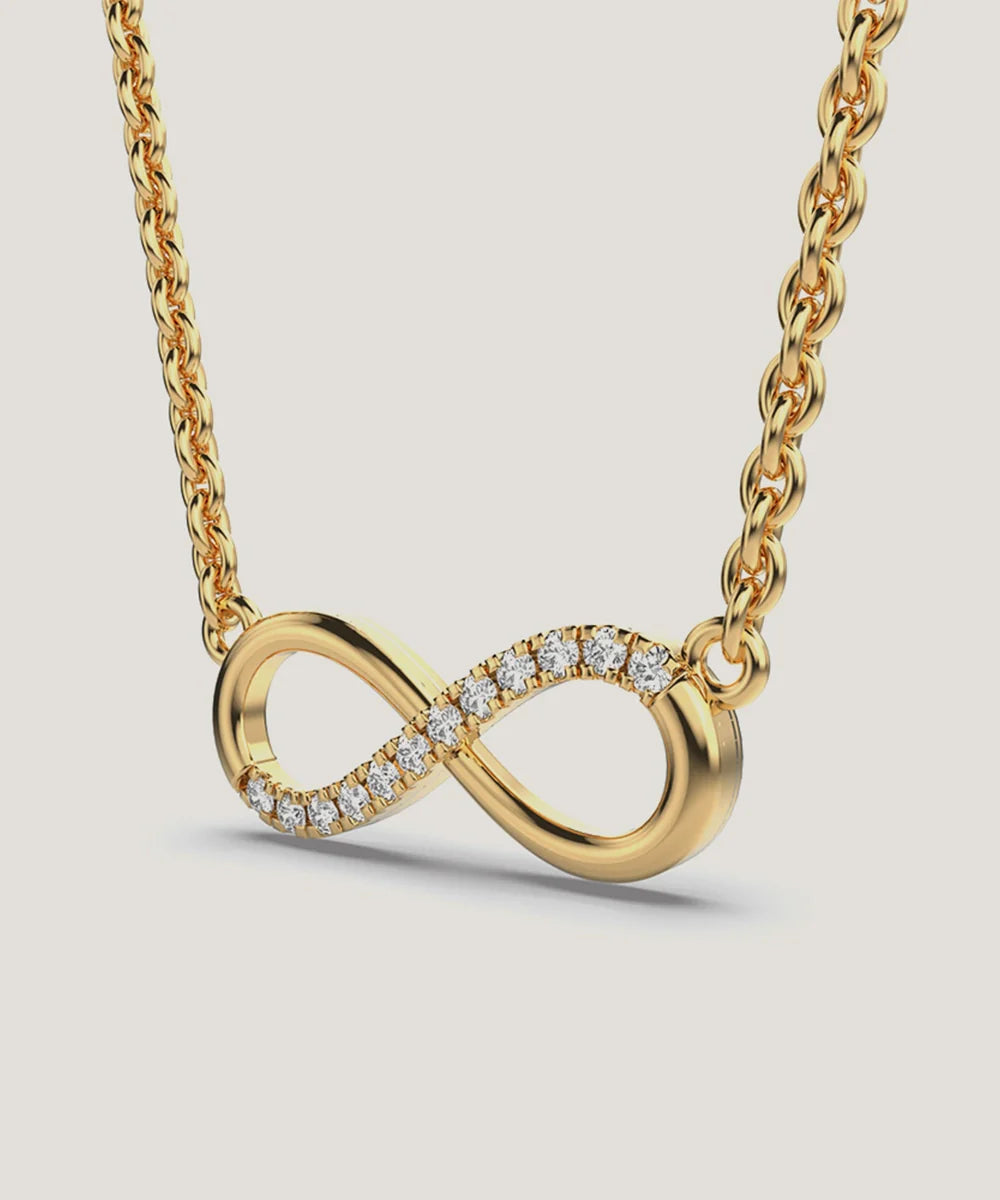 Infinity Pendant Necklace in a sleek high-contrast midnight luxury editorial style