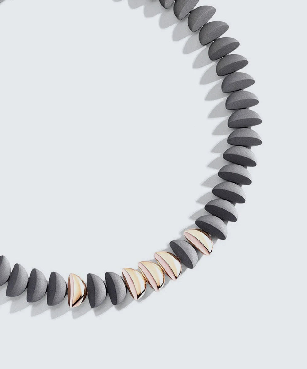 Gold Necklace With Black Stone Pendant in a sleek high-contrast midnight luxury editorial style