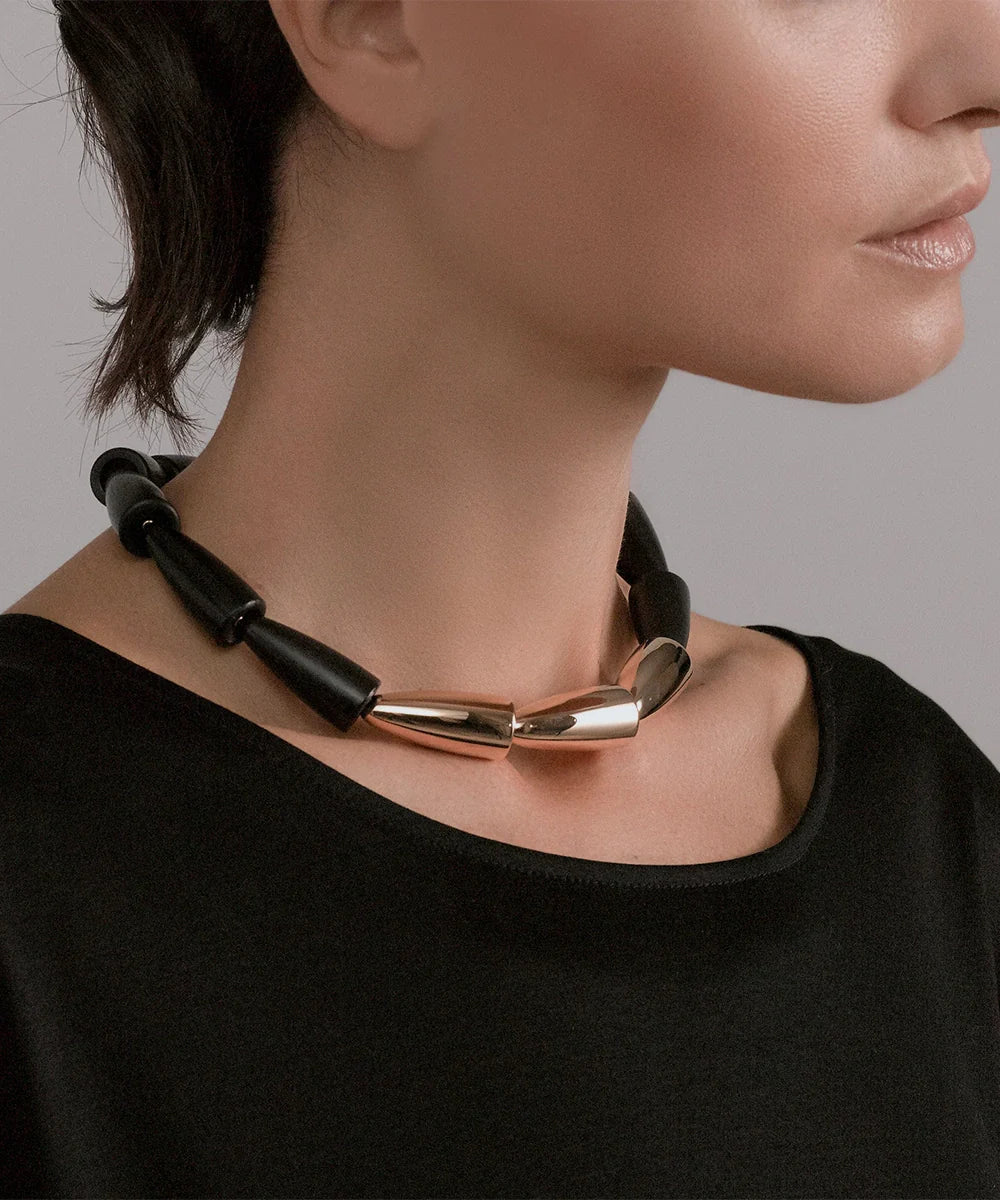 Peelerie jewelry piece in midnight luxury editorial product photo, high-contrast studio lighting