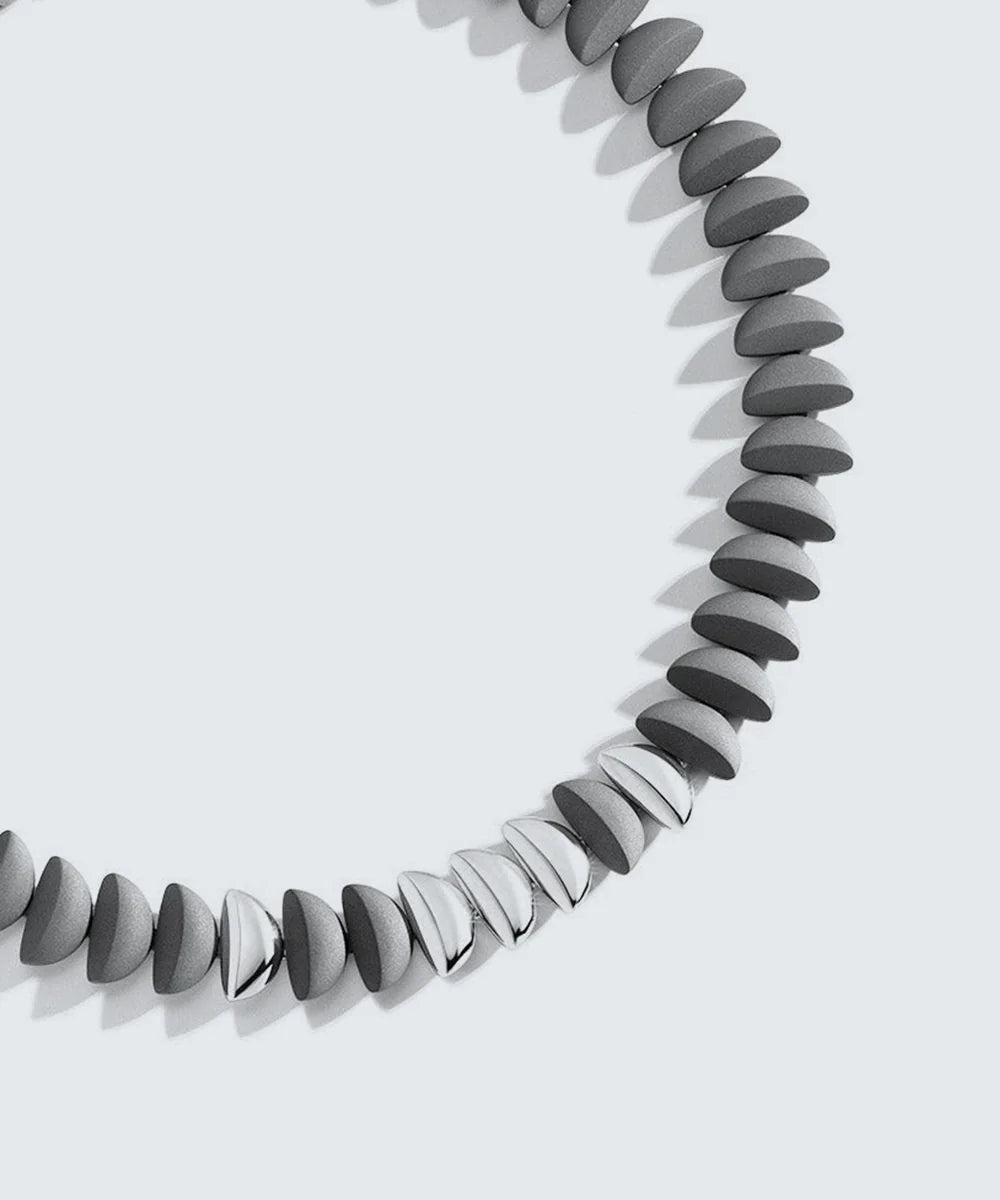 Peelerie jewelry piece in midnight luxury editorial product photo, high-contrast studio lighting