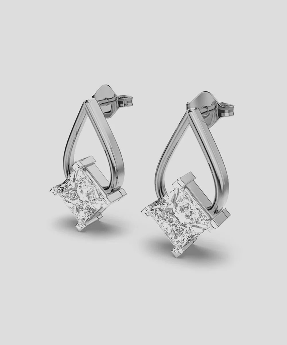 Solid Gold Drop Earring in a sleek high-contrast midnight luxury editorial style