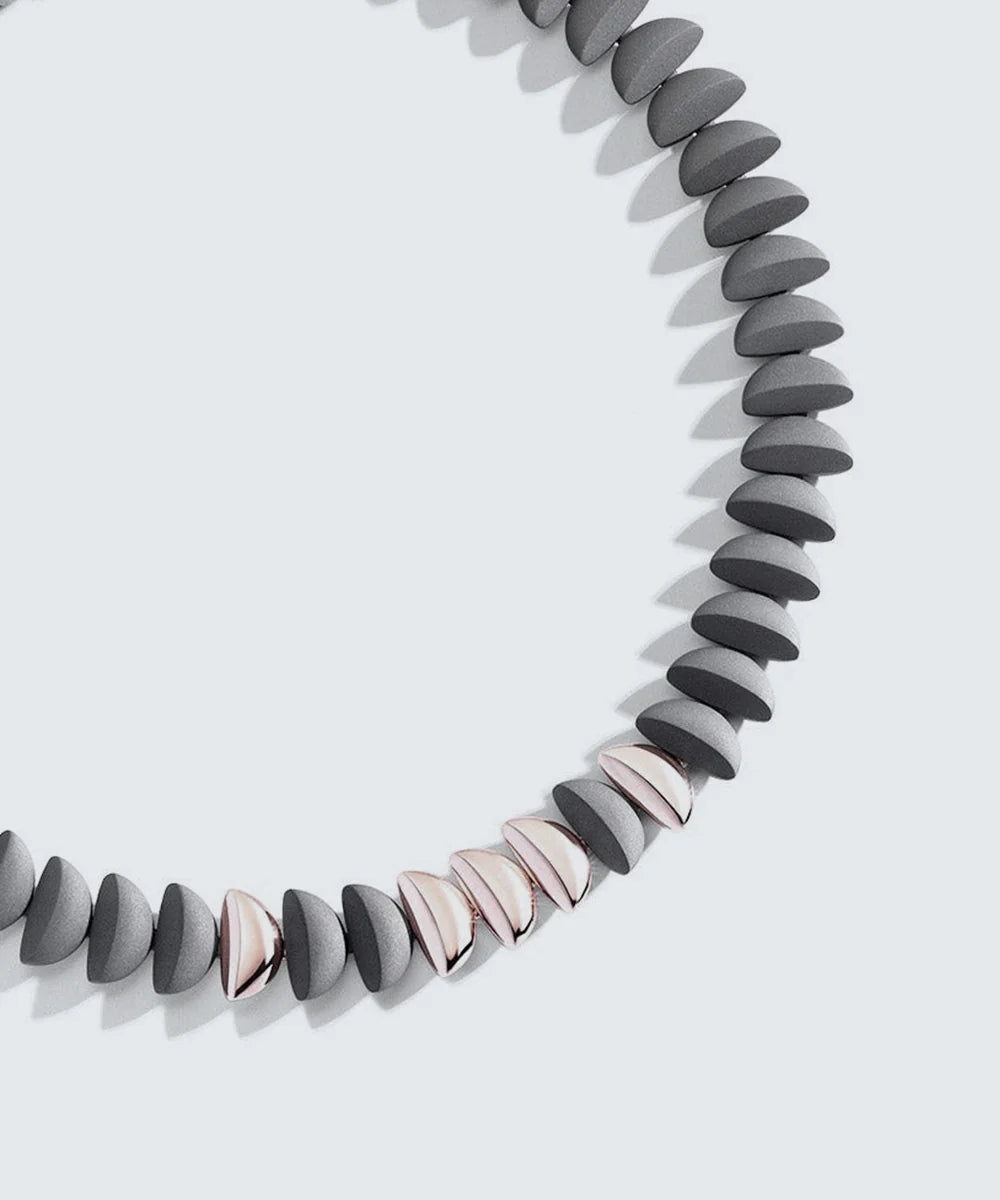 Peelerie jewelry piece in midnight luxury editorial product photo, high-contrast studio lighting