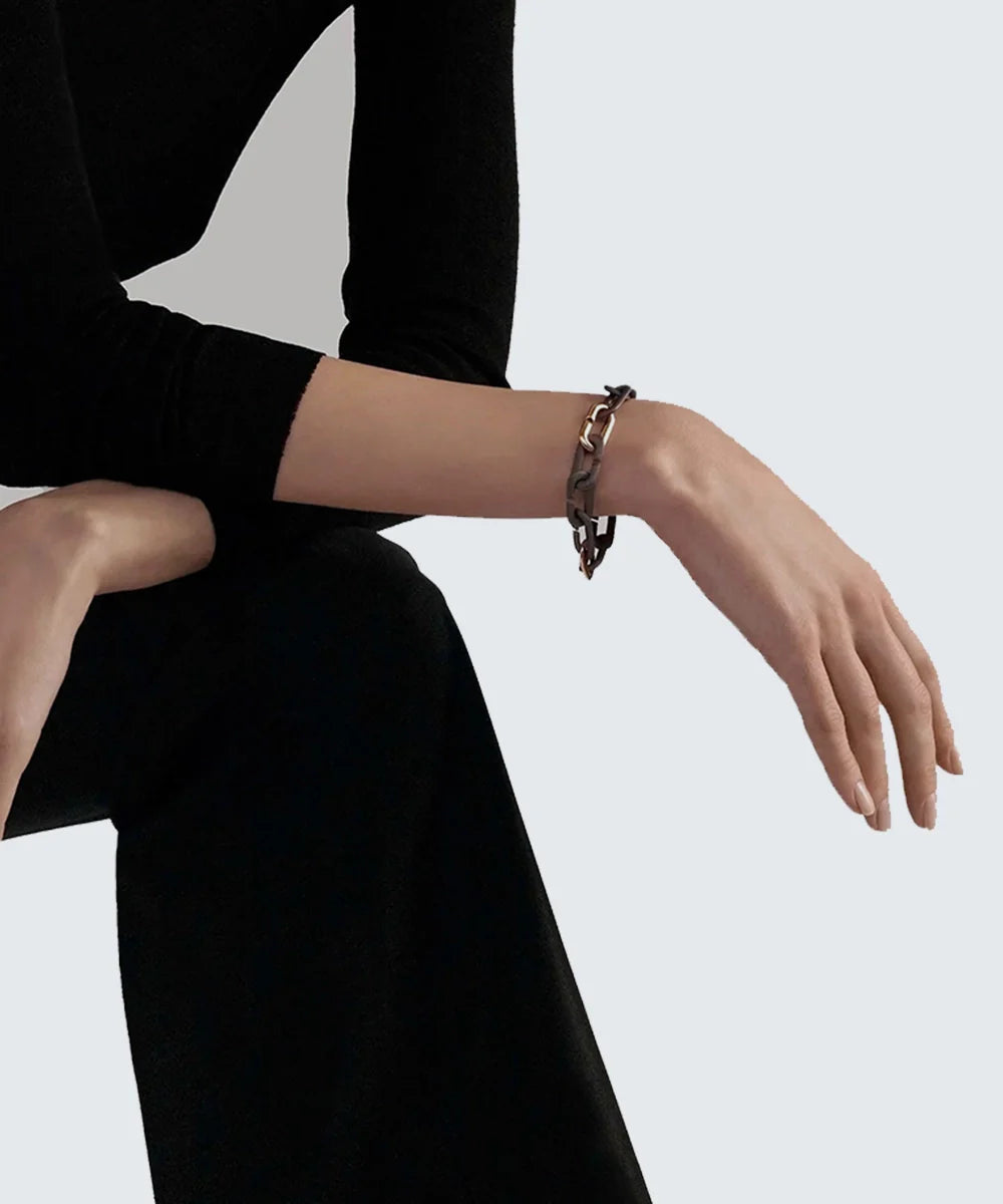 Peelerie jewelry piece in midnight luxury editorial product photo, high-contrast studio lighting