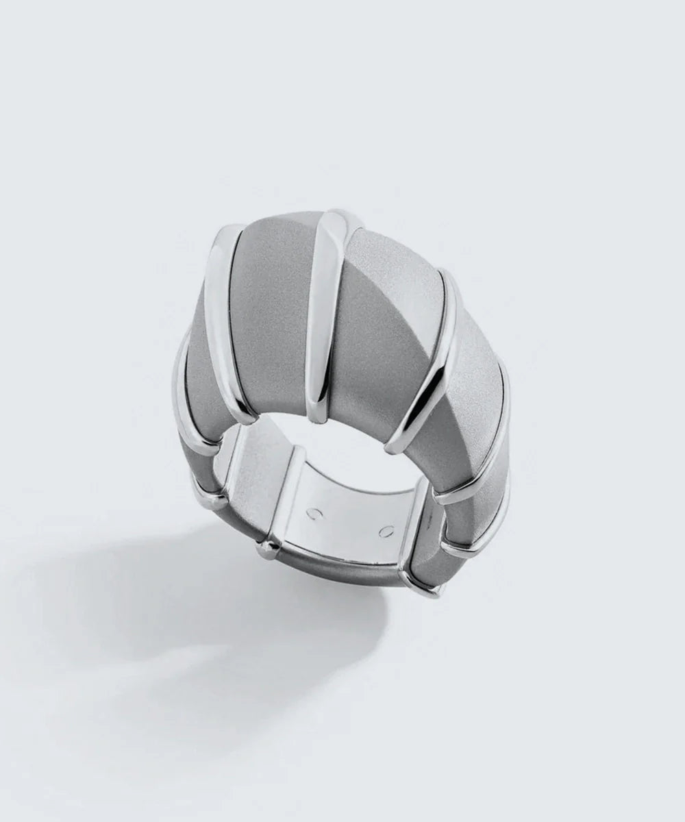 Peelerie jewelry piece in midnight luxury editorial product photo, high-contrast studio lighting