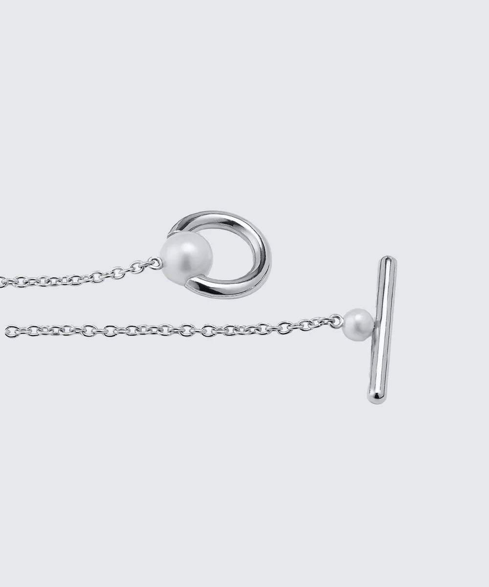 Peelerie jewelry piece in midnight luxury editorial product photo, high-contrast studio lighting