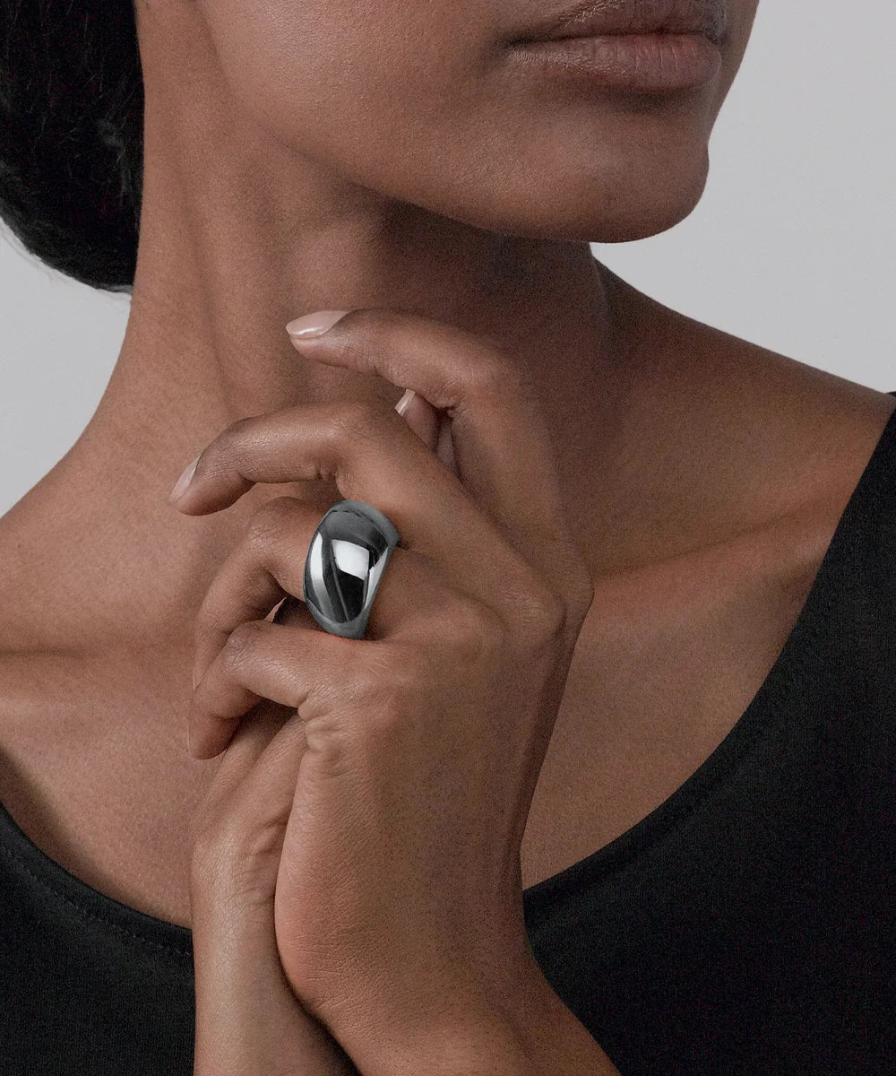 Peelerie jewelry piece in midnight luxury editorial product photo, high-contrast studio lighting