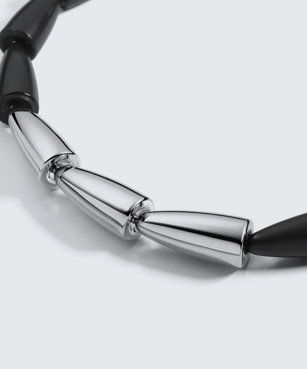 Peelerie jewelry piece in midnight luxury editorial product photo, high-contrast studio lighting