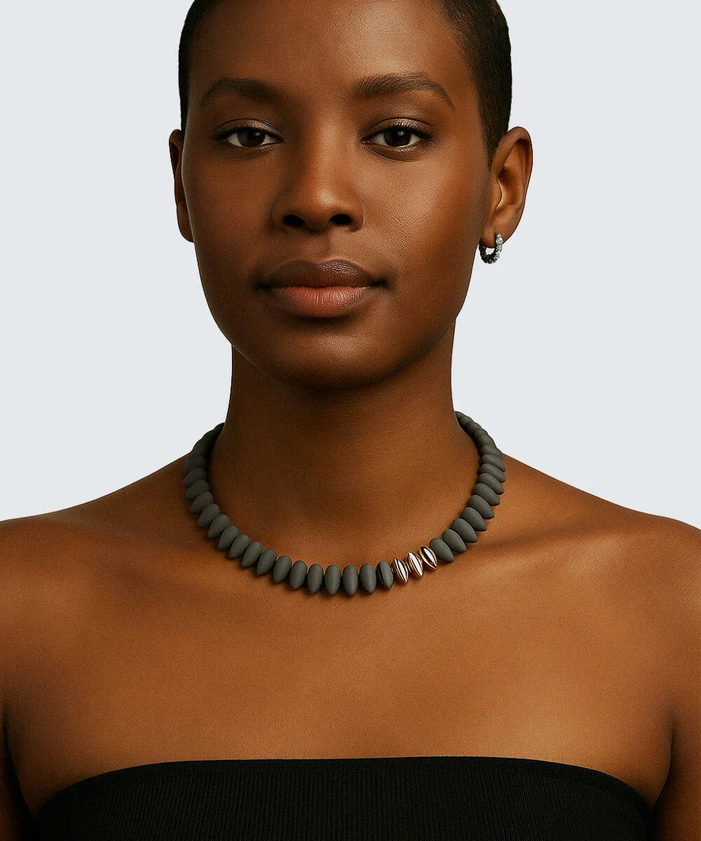 Peelerie jewelry piece in midnight luxury editorial product photo, high-contrast studio lighting