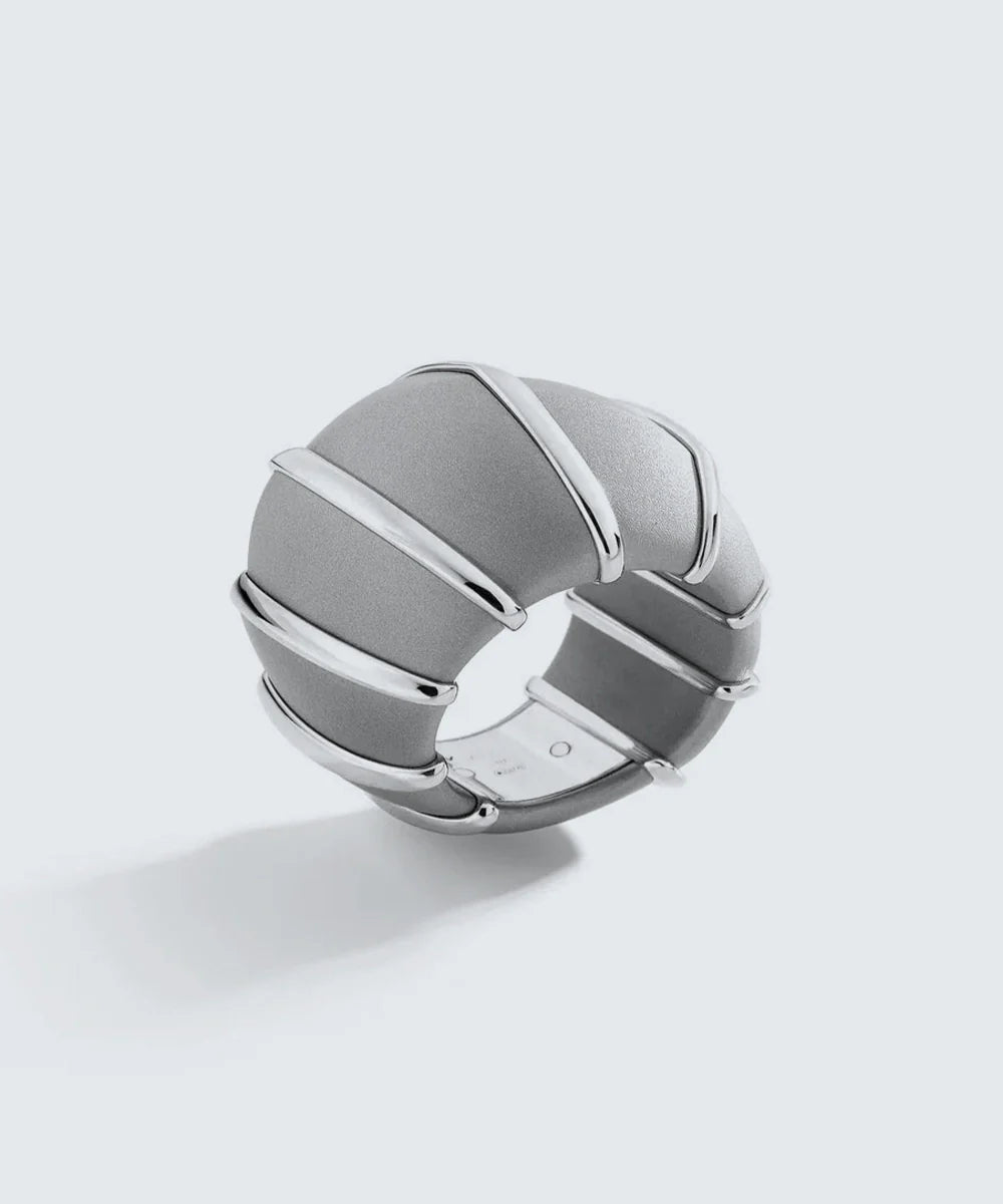 Peelerie jewelry piece in midnight luxury editorial product photo, high-contrast studio lighting