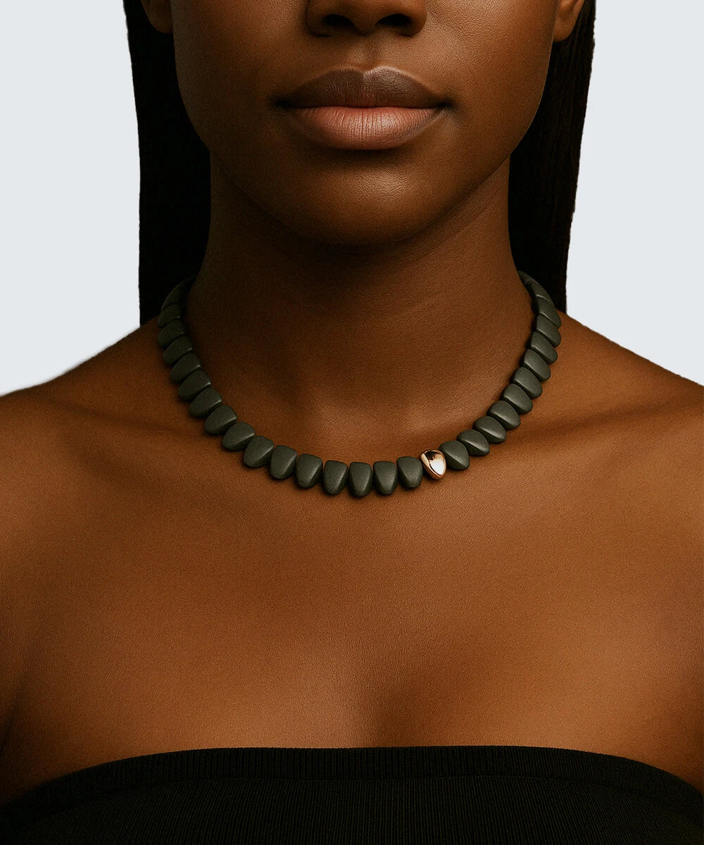 Peelerie jewelry piece in midnight luxury editorial product photo, high-contrast studio lighting