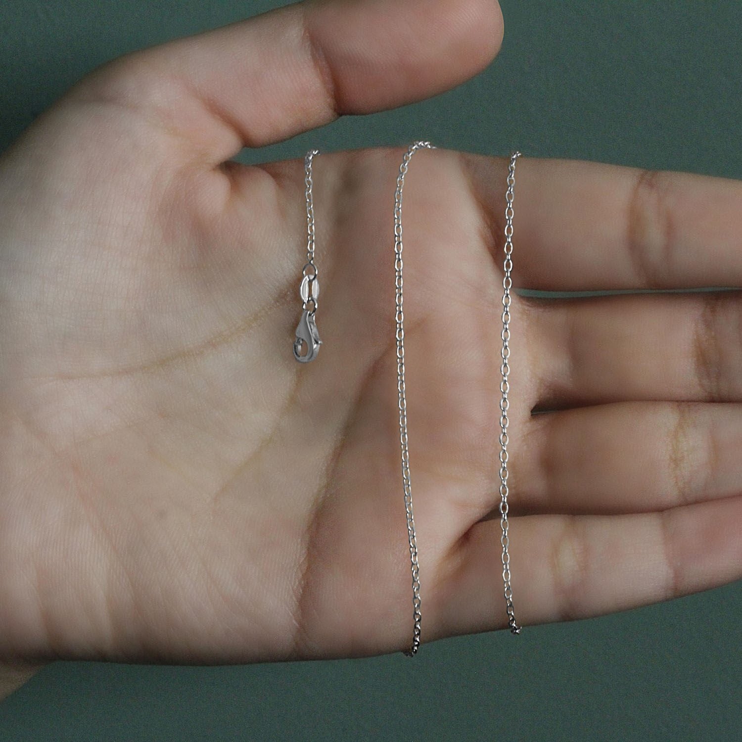 Peelerie jewelry piece in midnight luxury editorial product photo, high-contrast studio lighting