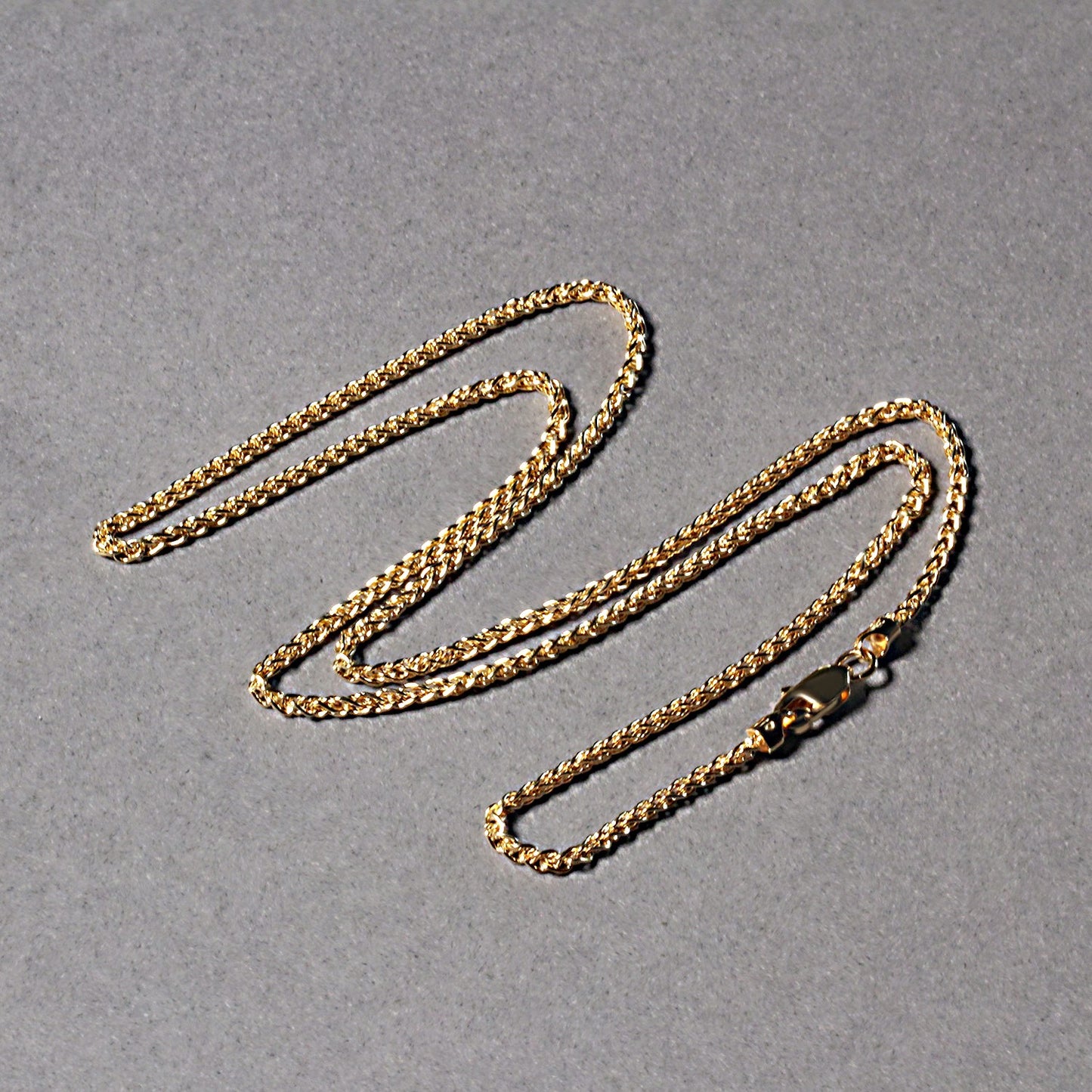 Peelerie jewelry piece in gold midnight luxury editorial product photo, high-contrast studio lighting