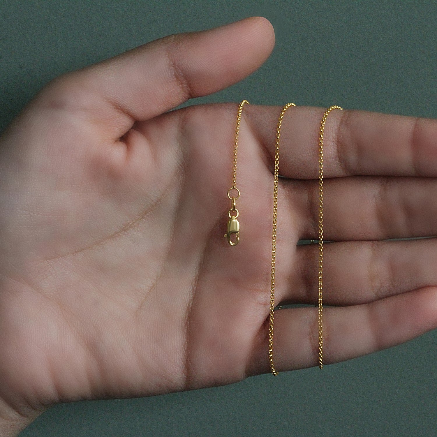 Peelerie jewelry piece in midnight luxury editorial product photo, high-contrast studio lighting