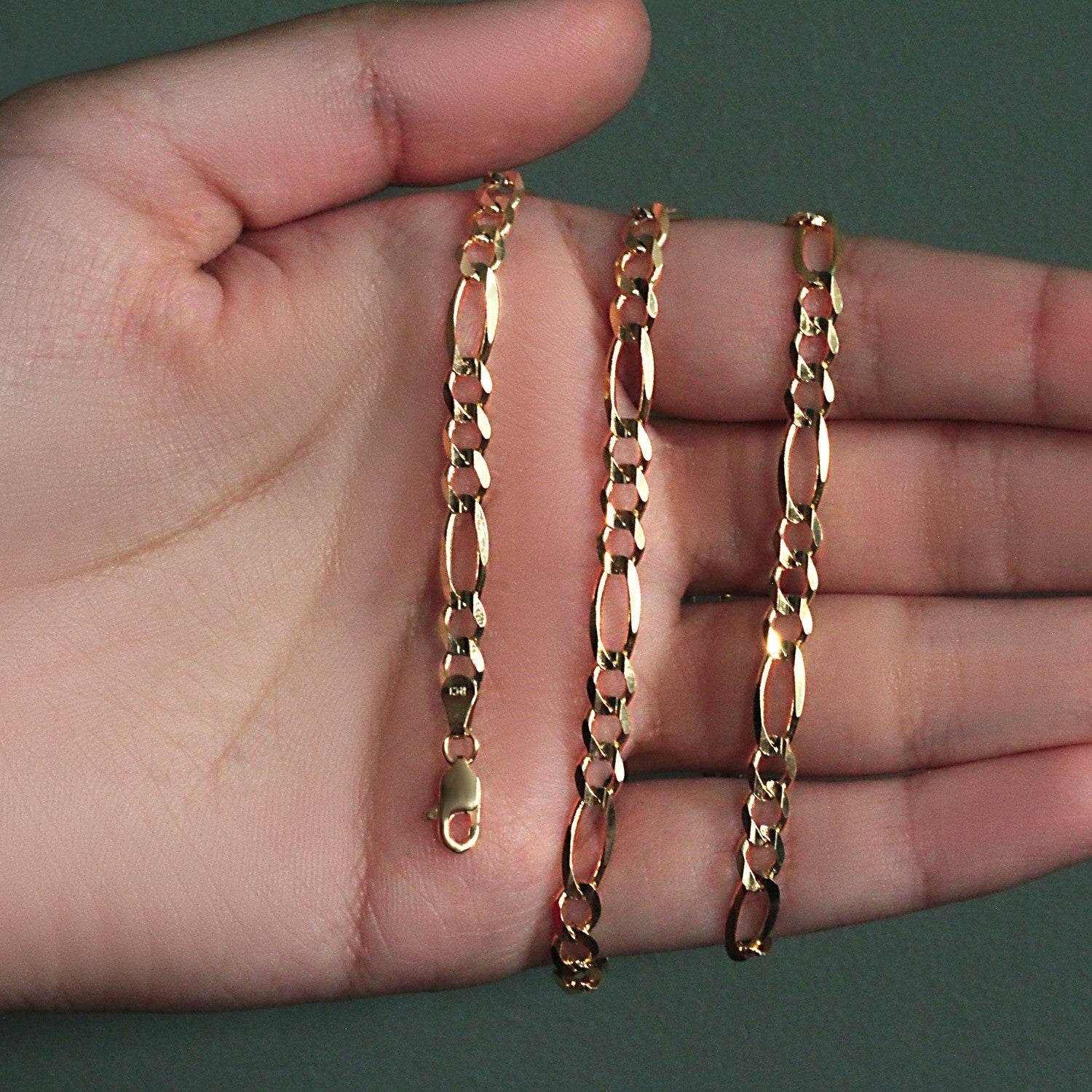 10K Yellow Gold Solid Figaro Chain (4.50 mm) in a sleek high-contrast midnight luxury editorial style