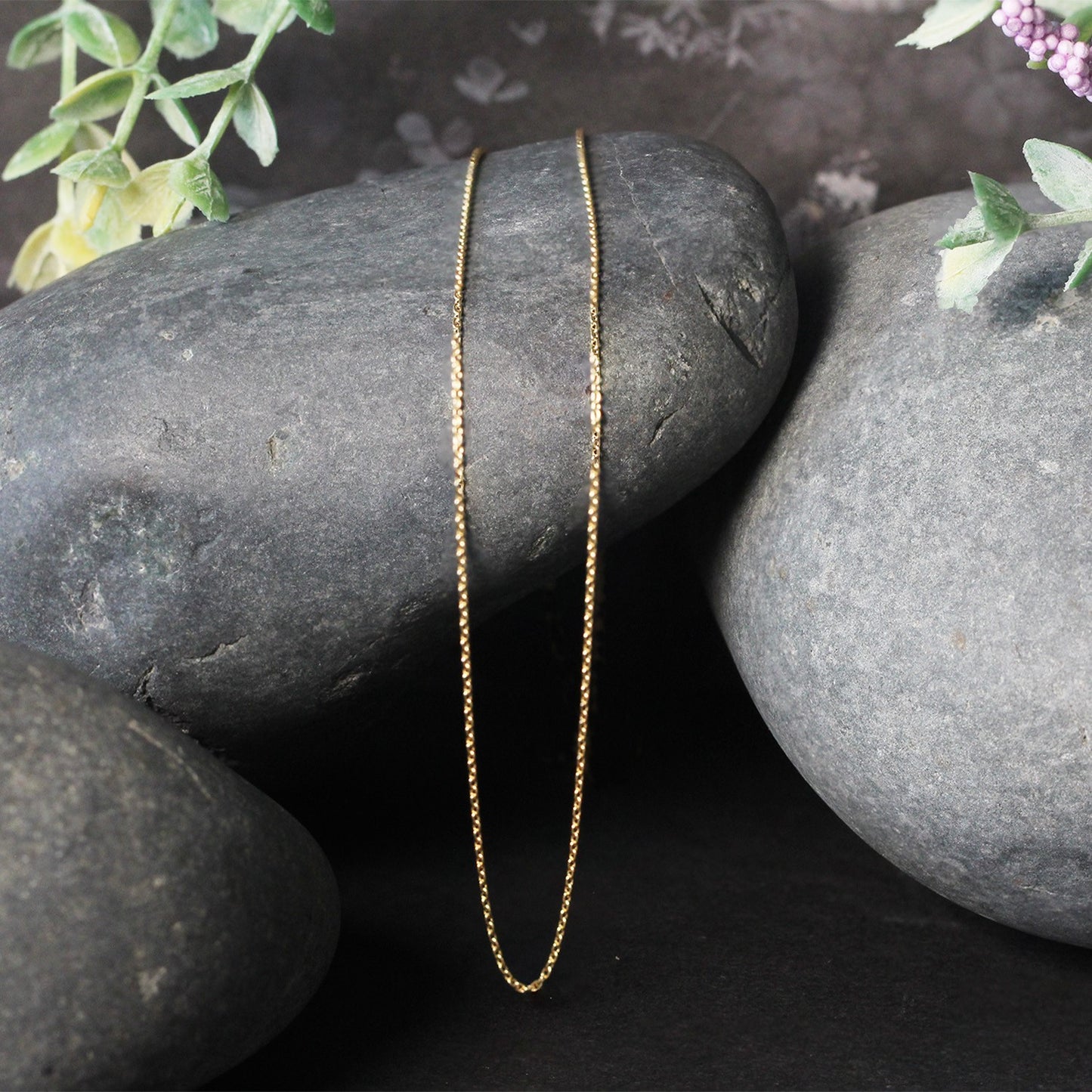 14k Yellow Gold Oval Cable Link Chain (0.97 mm) in a sleek high-contrast midnight luxury editorial style