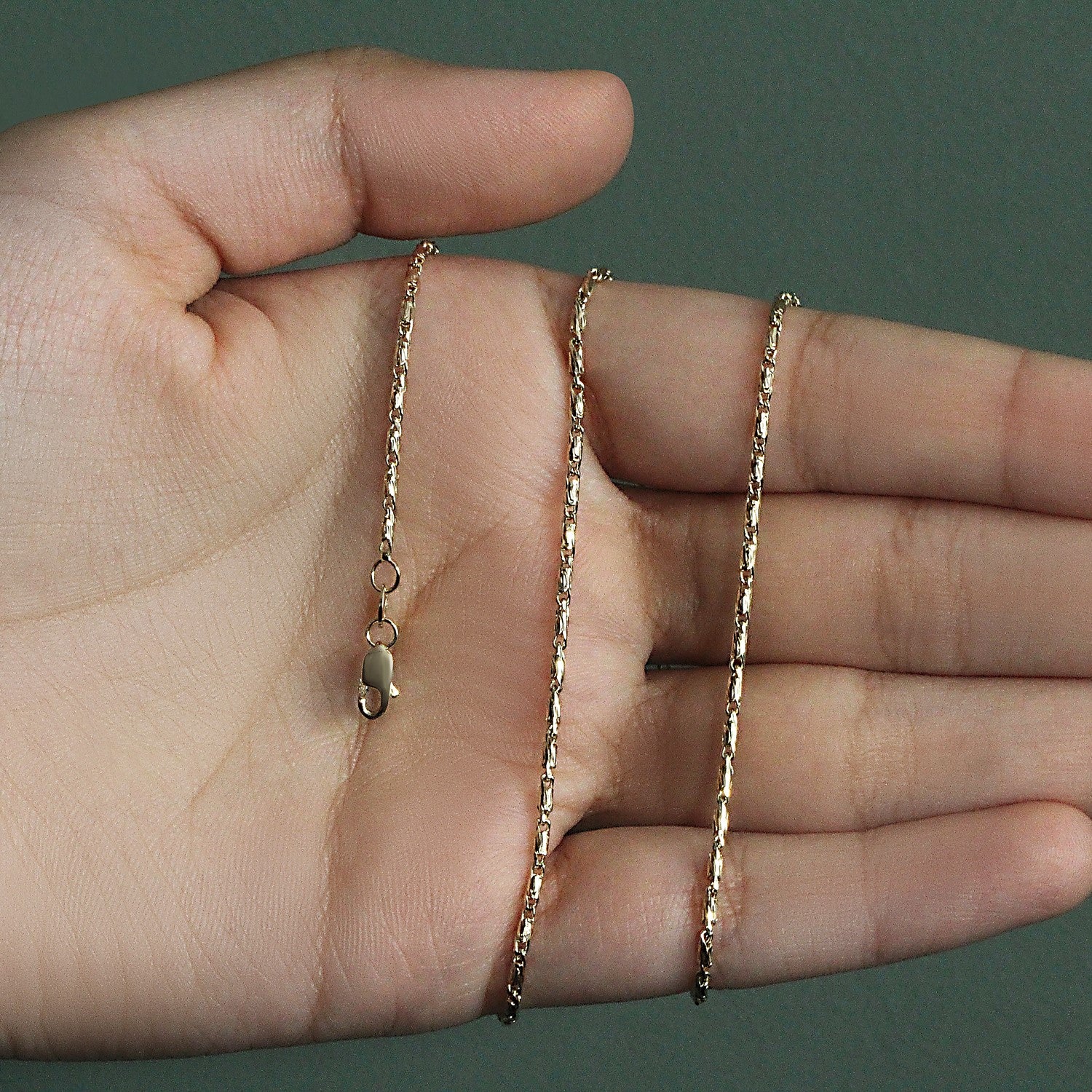 Peelerie jewelry piece in midnight luxury editorial product photo, high-contrast studio lighting