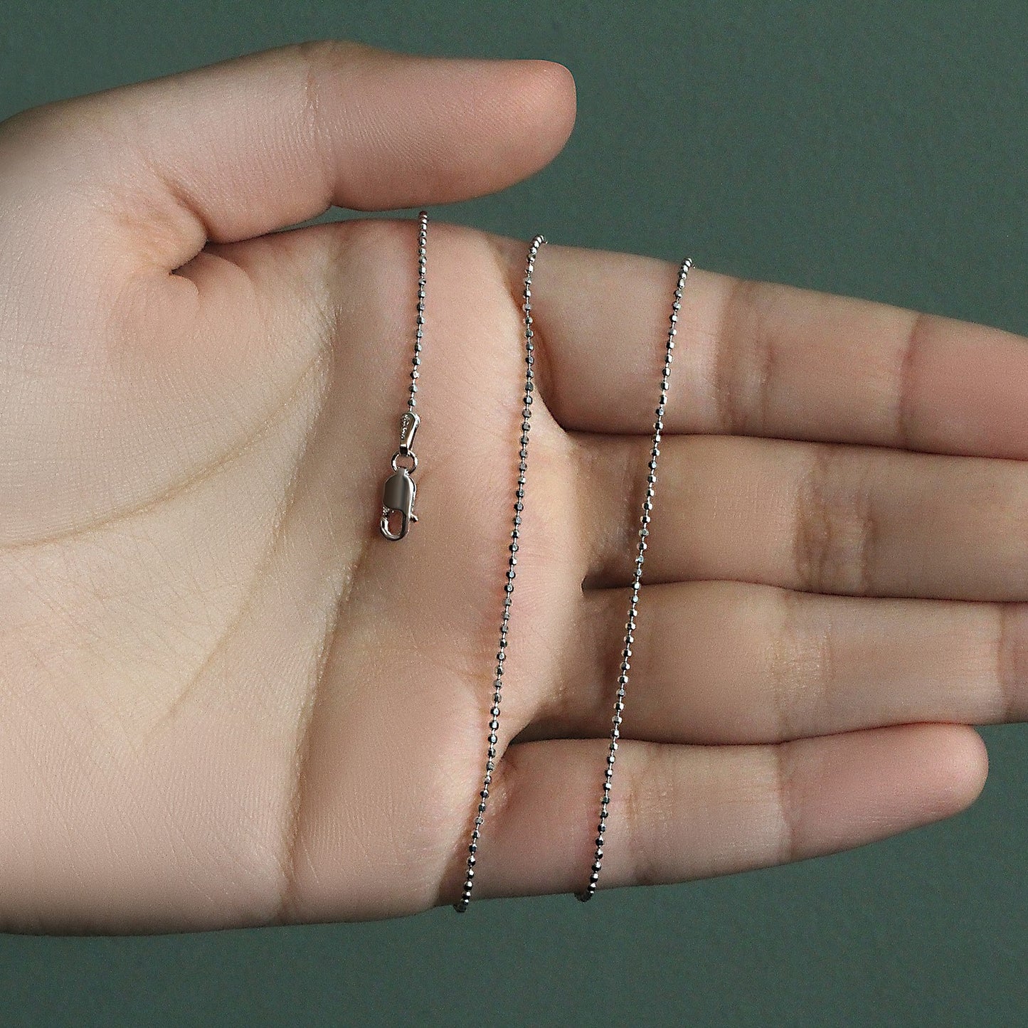 Peelerie jewelry piece in midnight luxury editorial product photo, high-contrast studio lighting