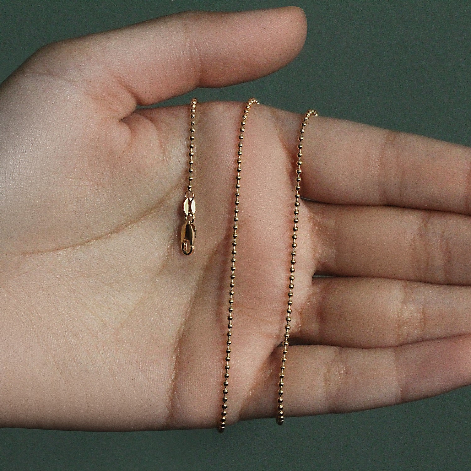 Peelerie jewelry piece in midnight luxury editorial product photo, high-contrast studio lighting