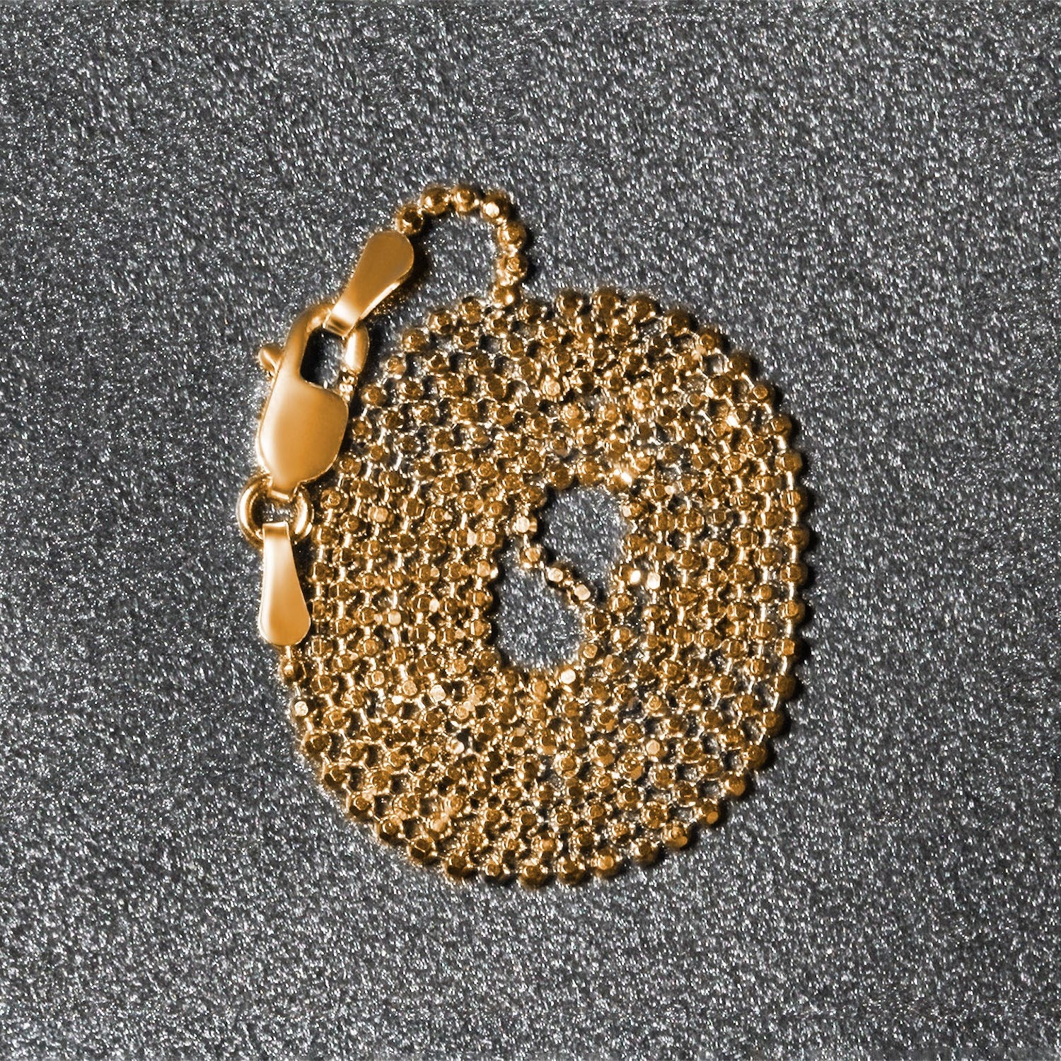 Peelerie jewelry piece in midnight luxury editorial product photo, high-contrast studio lighting