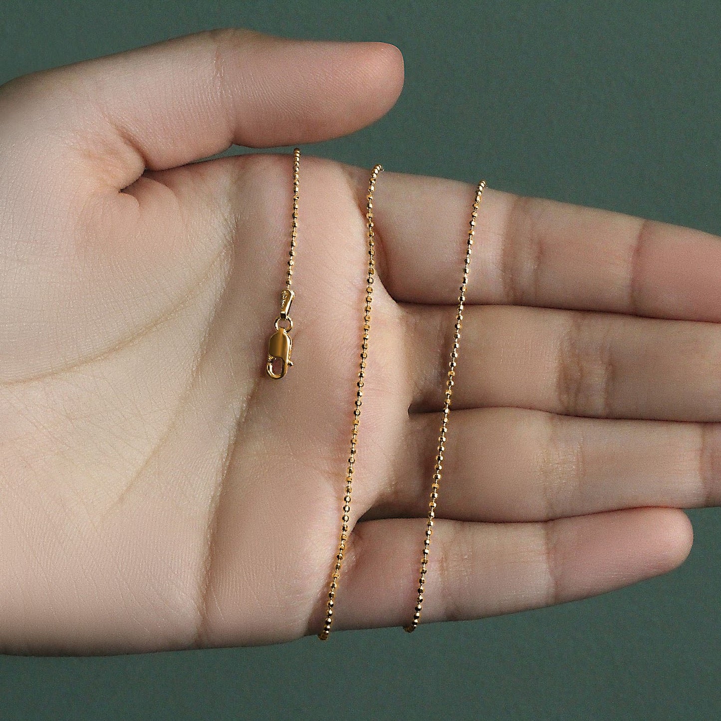 Peelerie jewelry piece in midnight luxury editorial product photo, high-contrast studio lighting