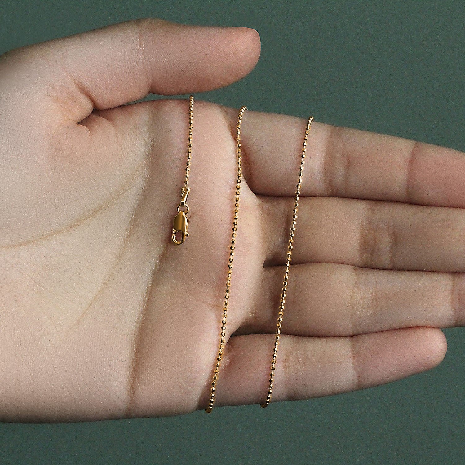 Peelerie jewelry piece in midnight luxury editorial product photo, high-contrast studio lighting