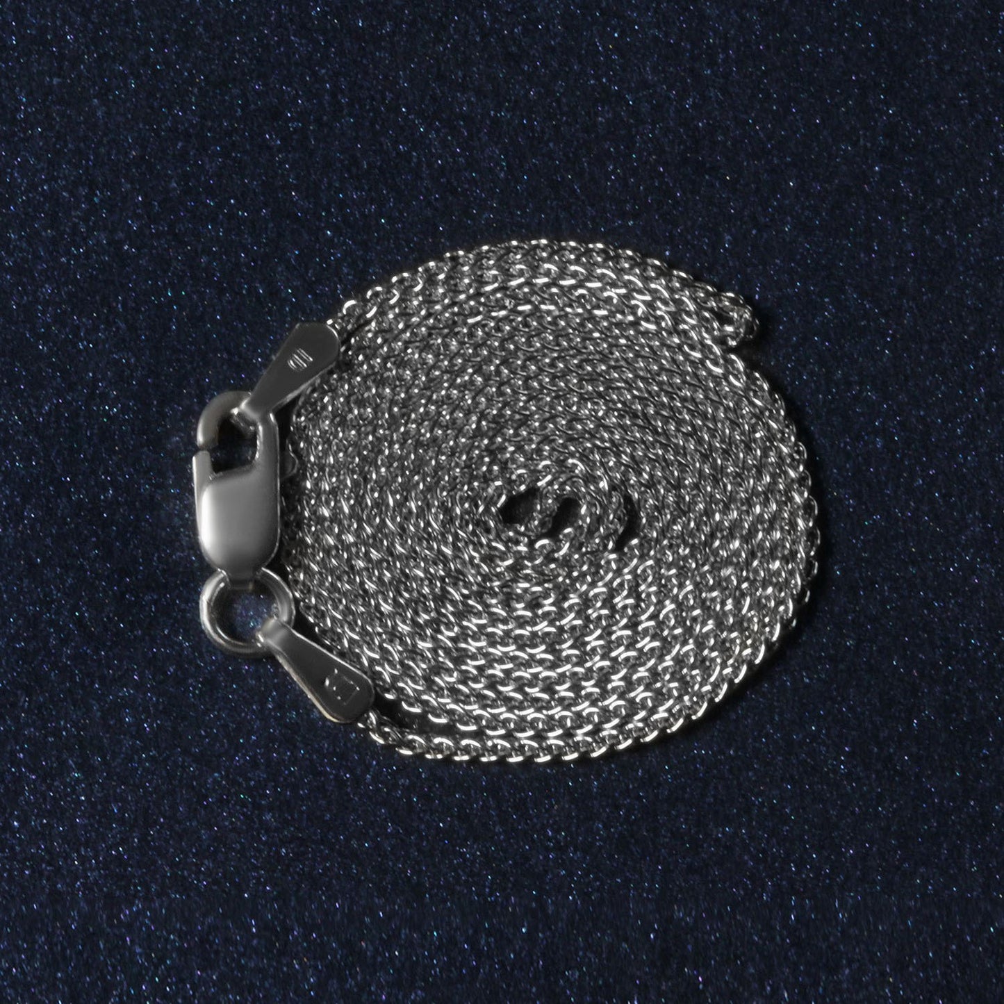 Peelerie jewelry piece in midnight luxury editorial product photo, high-contrast studio lighting