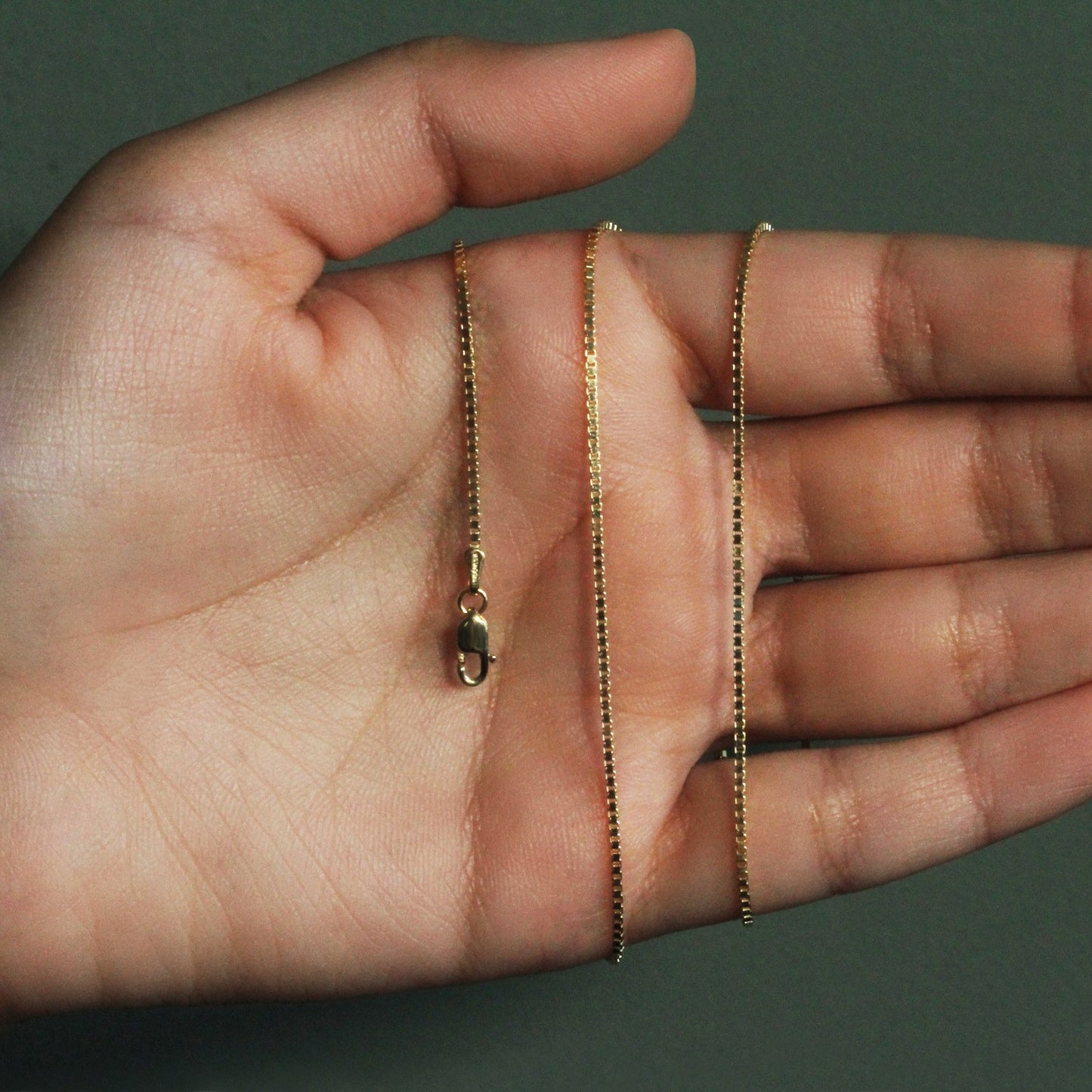 Peelerie jewelry piece in midnight luxury editorial product photo, high-contrast studio lighting