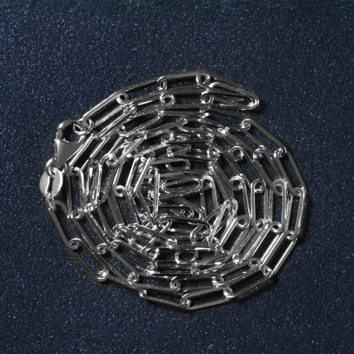 Peelerie jewelry piece in midnight luxury editorial product photo, high-contrast studio lighting