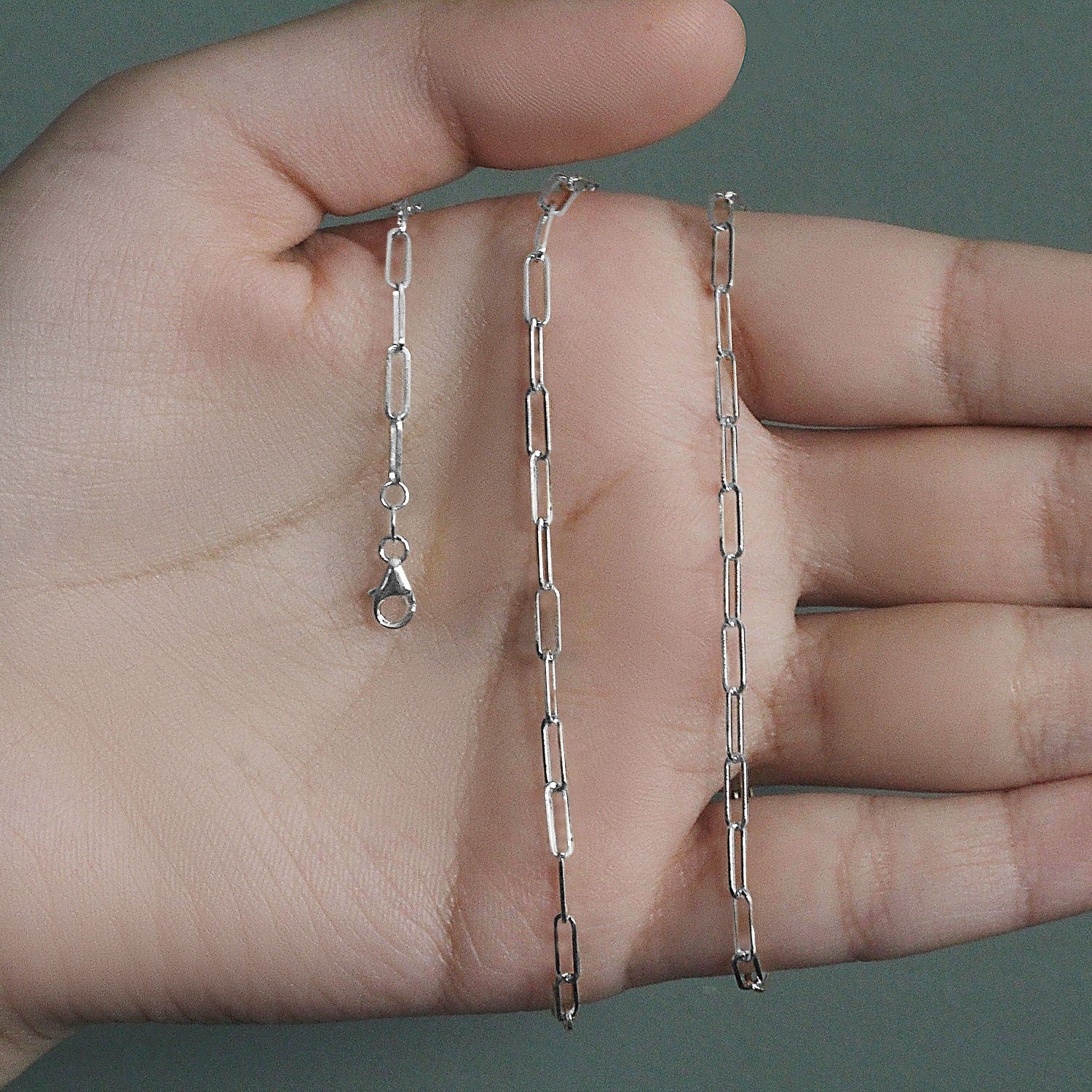 Peelerie jewelry piece in midnight luxury editorial product photo, high-contrast studio lighting