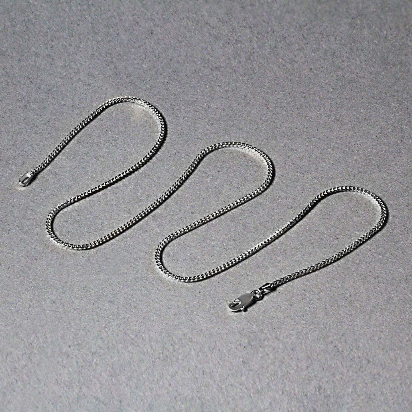 Peelerie jewelry piece in midnight luxury editorial product photo, high-contrast studio lighting