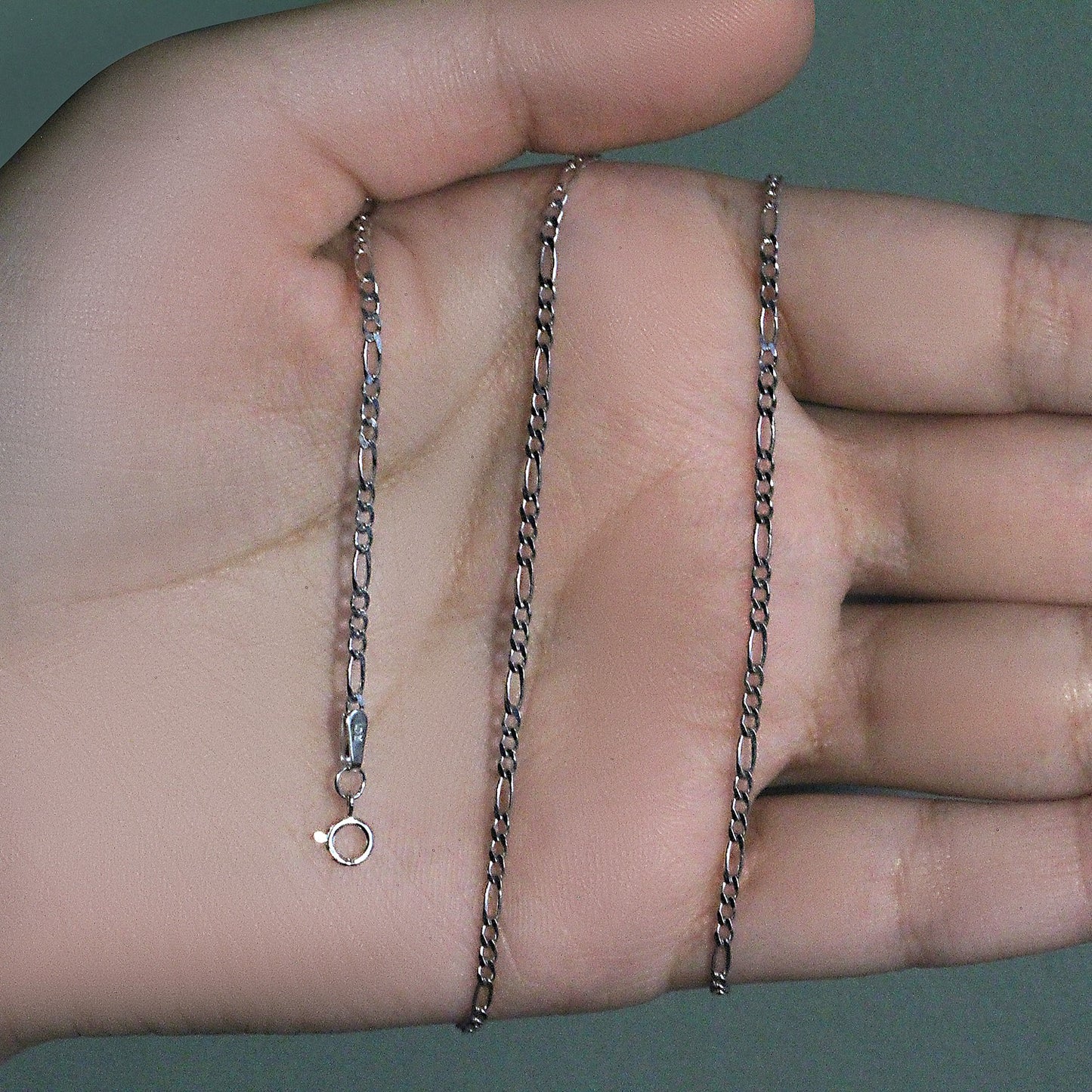 Peelerie jewelry piece in midnight luxury editorial product photo, high-contrast studio lighting