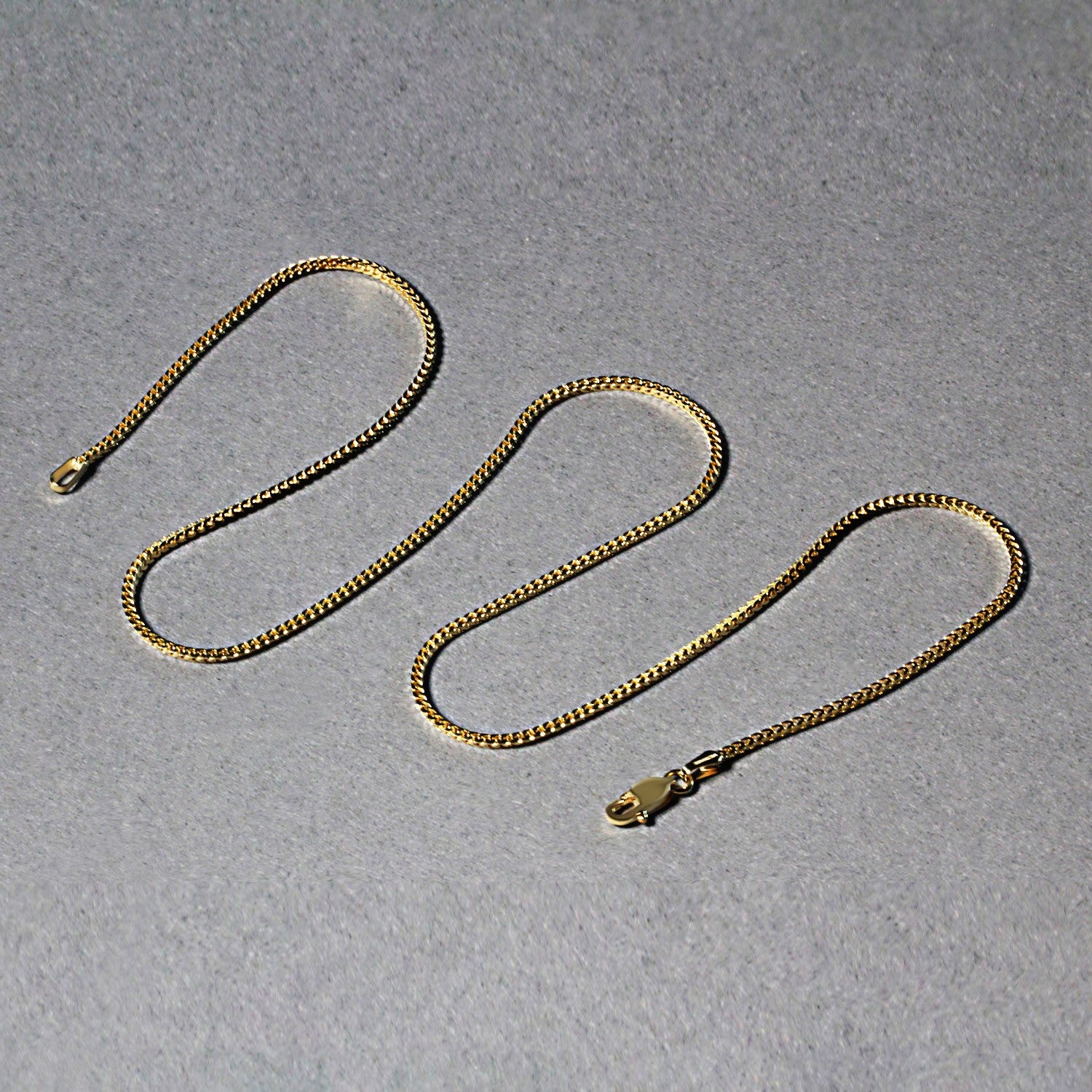 Peelerie jewelry piece in midnight luxury editorial product photo, high-contrast studio lighting