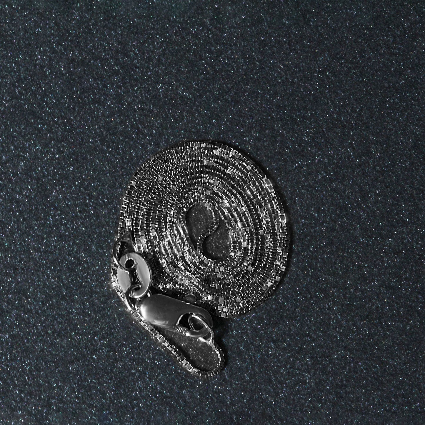 Peelerie jewelry piece in midnight luxury editorial product photo, high-contrast studio lighting