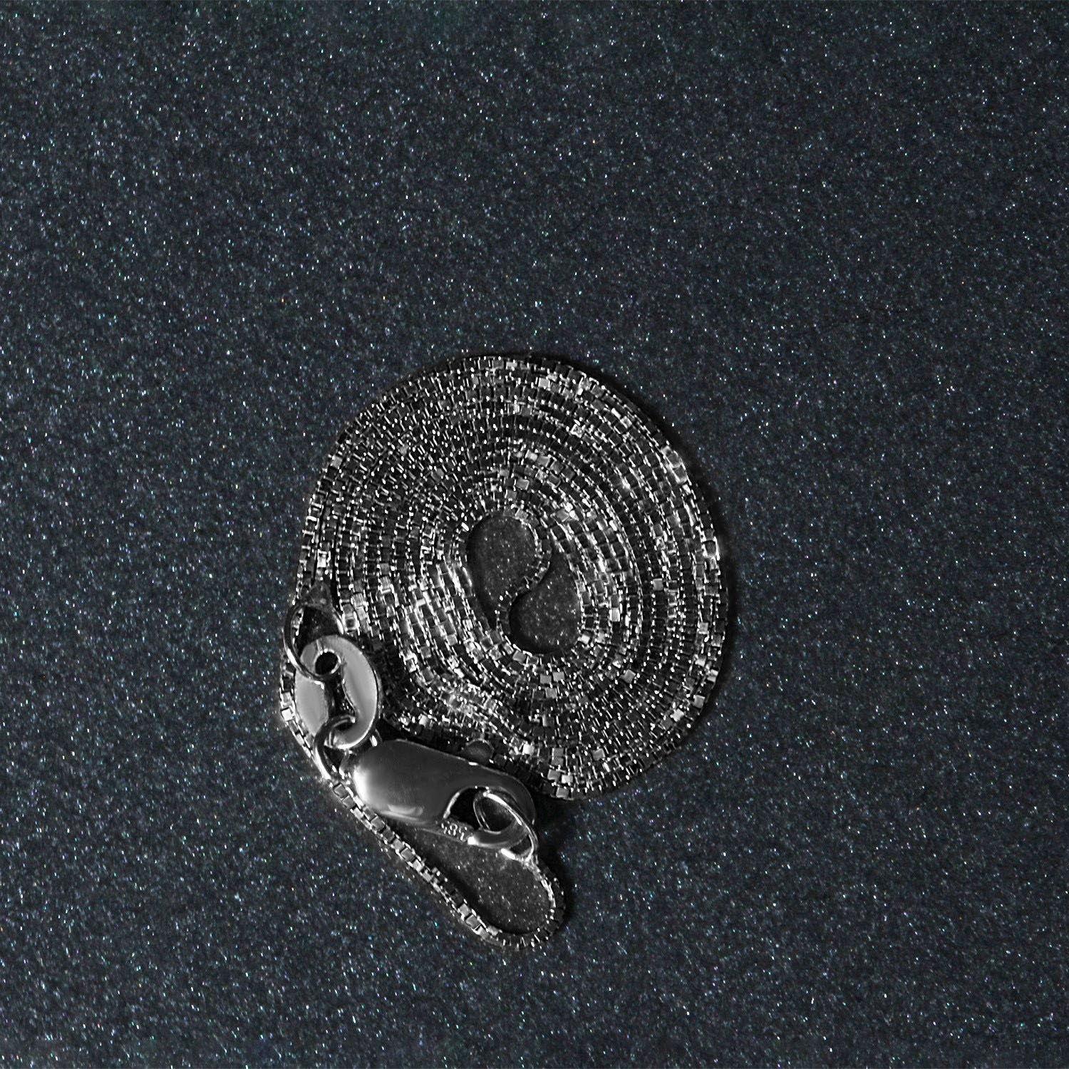 Peelerie jewelry piece in midnight luxury editorial product photo, high-contrast studio lighting