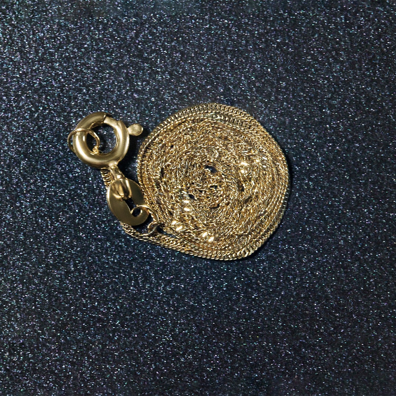 Peelerie jewelry piece in midnight luxury editorial product photo, high-contrast studio lighting