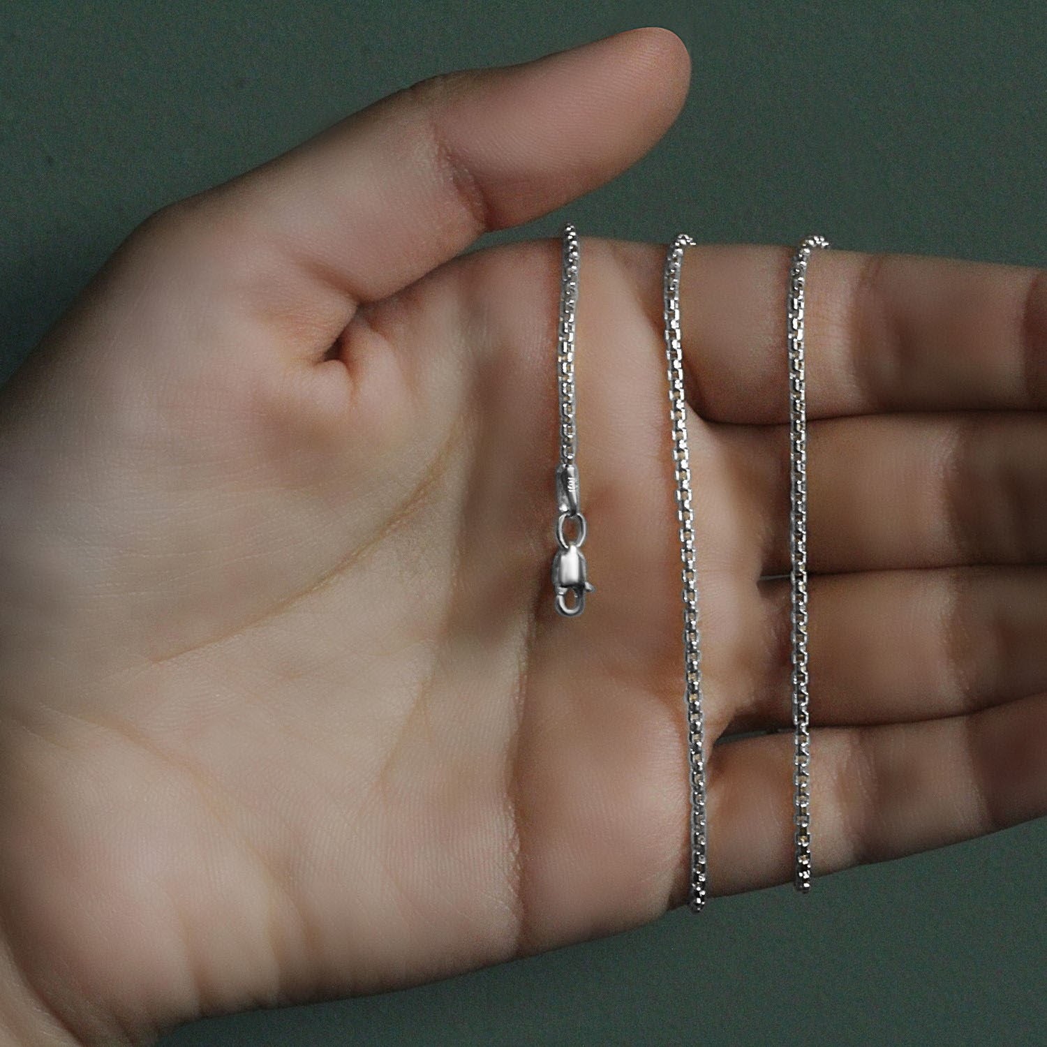 Peelerie jewelry piece in midnight luxury editorial product photo, high-contrast studio lighting