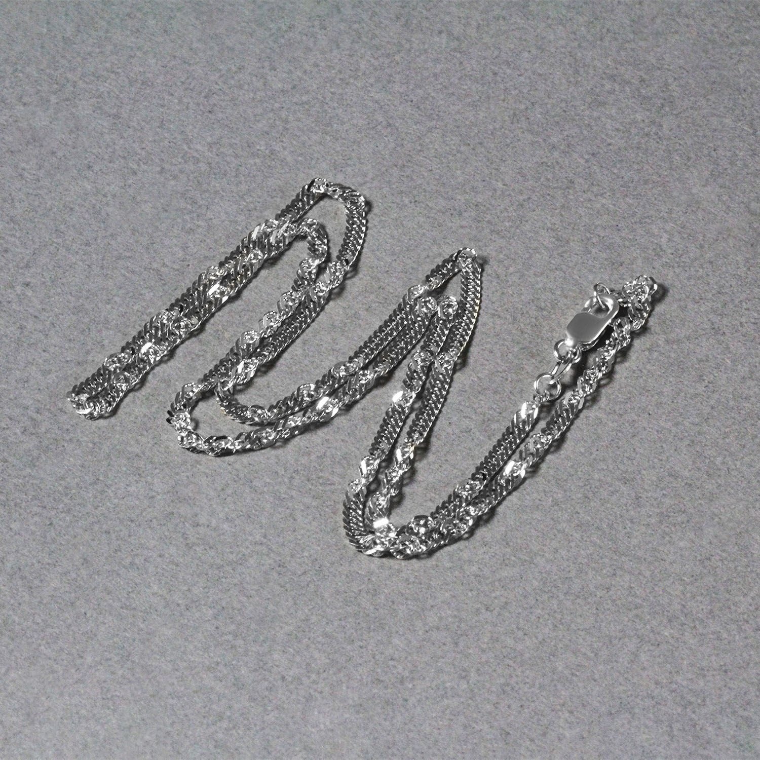 Peelerie jewelry piece in gold midnight luxury editorial product photo, high-contrast studio lighting