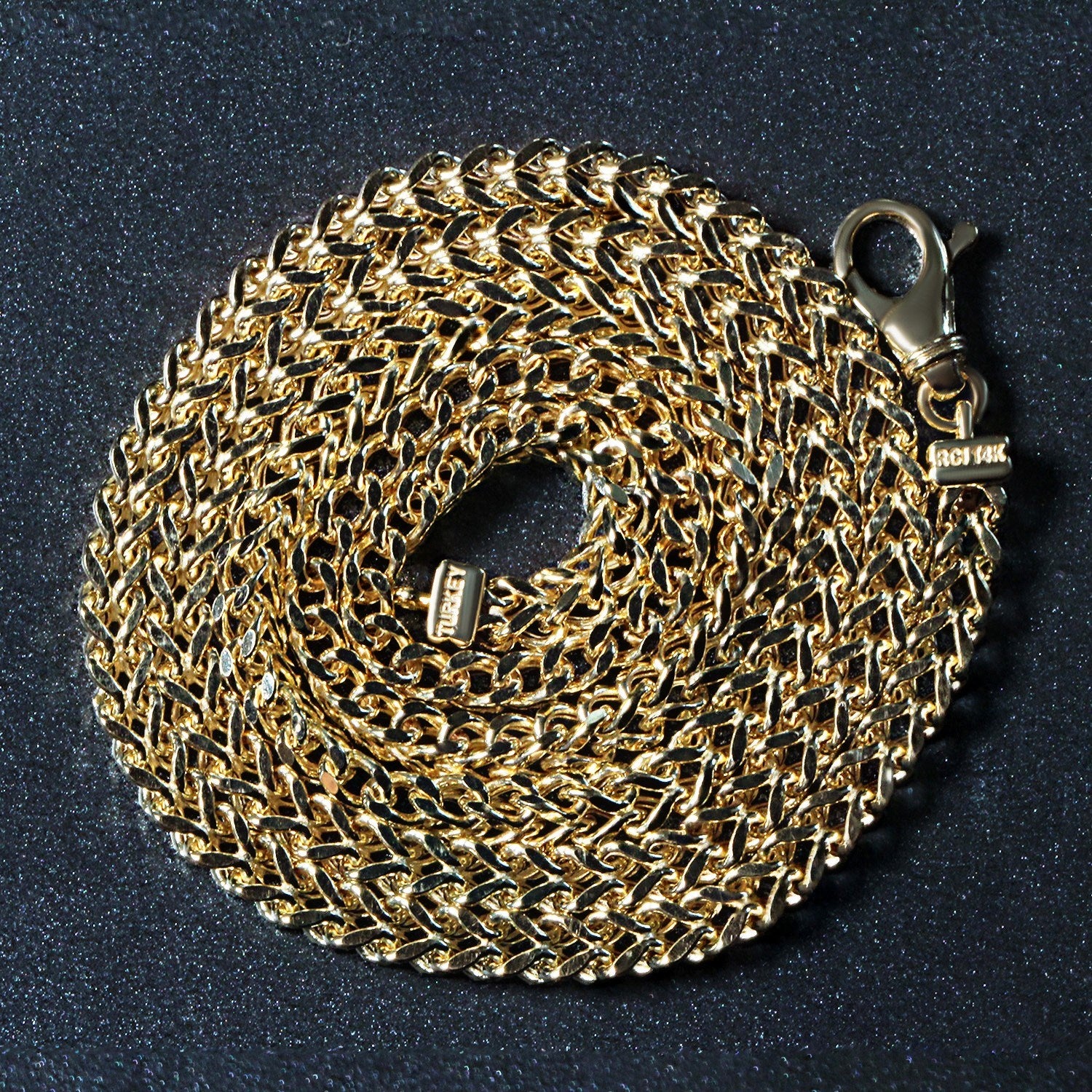 Peelerie jewelry piece in midnight luxury editorial product photo, high-contrast studio lighting