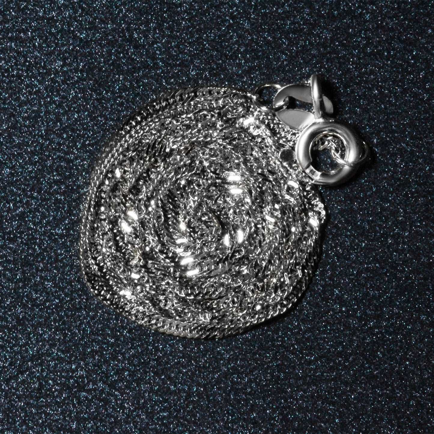 Peelerie jewelry piece in midnight luxury editorial product photo, high-contrast studio lighting