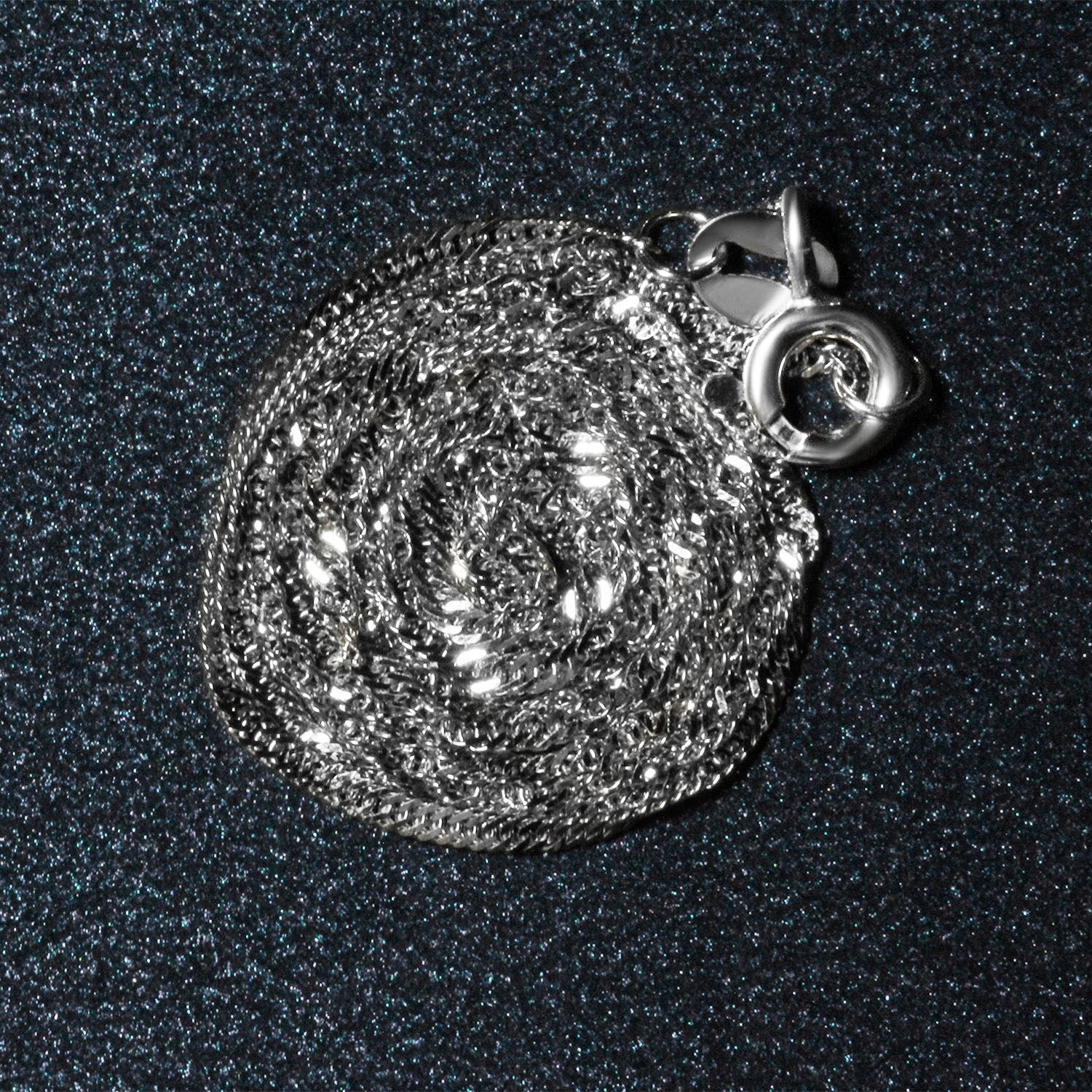 Peelerie jewelry piece in midnight luxury editorial product photo, high-contrast studio lighting