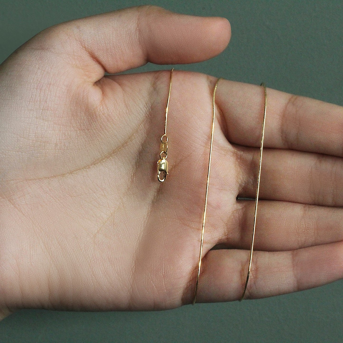 Peelerie jewelry piece in midnight luxury editorial product photo, high-contrast studio lighting