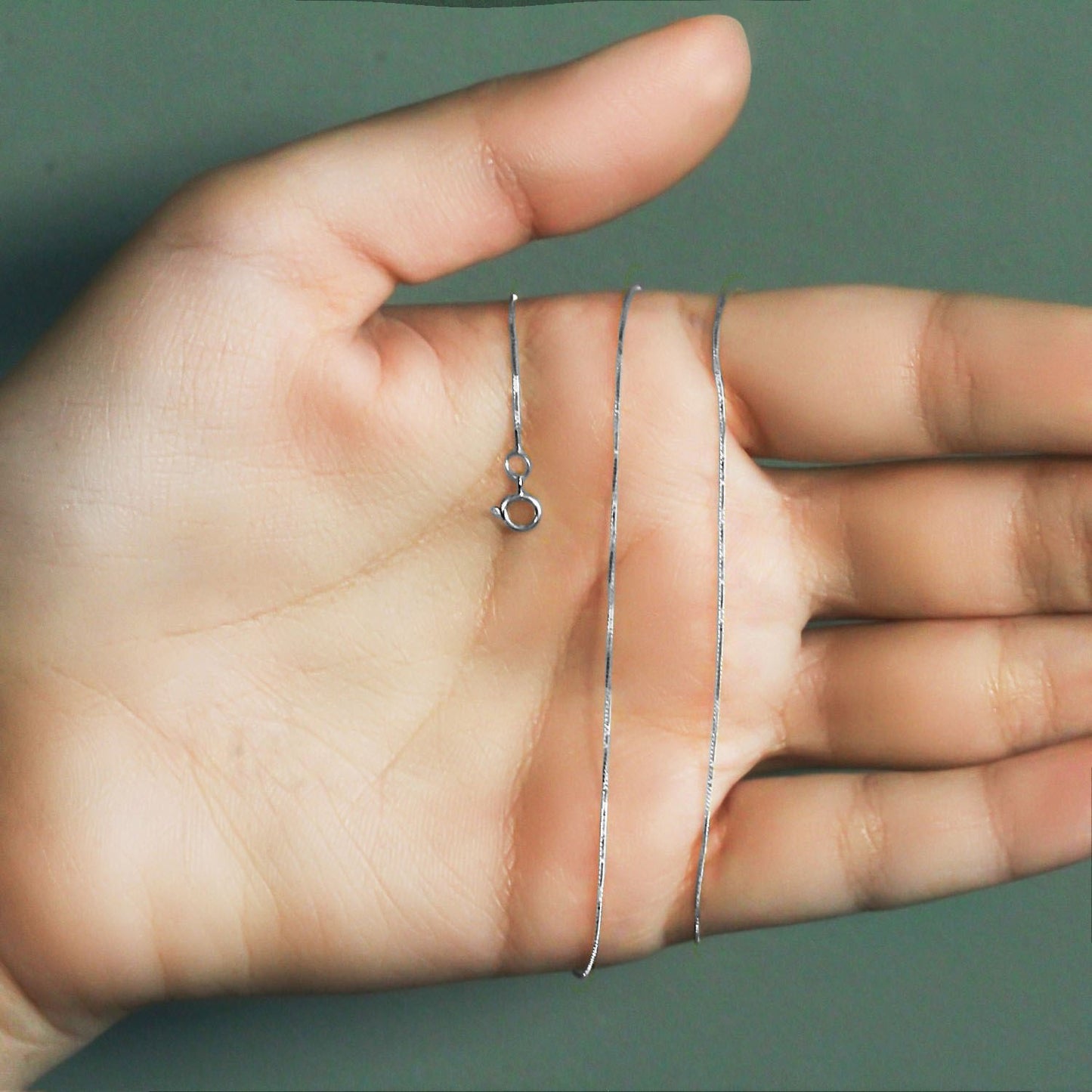 Peelerie jewelry piece in midnight luxury editorial product photo, high-contrast studio lighting