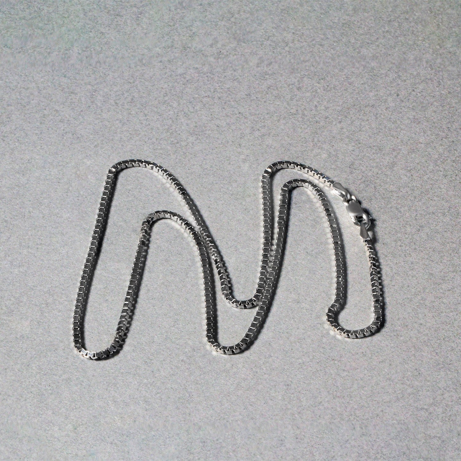 Peelerie jewelry piece in gold midnight luxury editorial product photo, high-contrast studio lighting