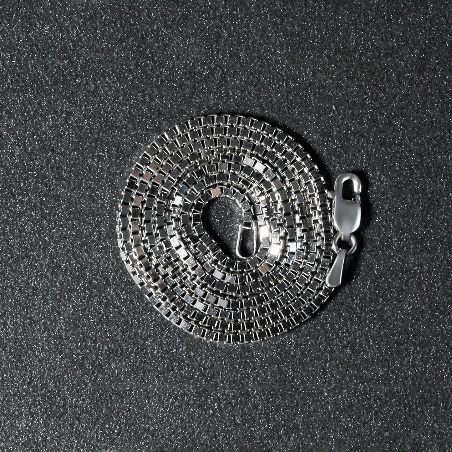 Peelerie jewelry piece in midnight luxury editorial product photo, high-contrast studio lighting